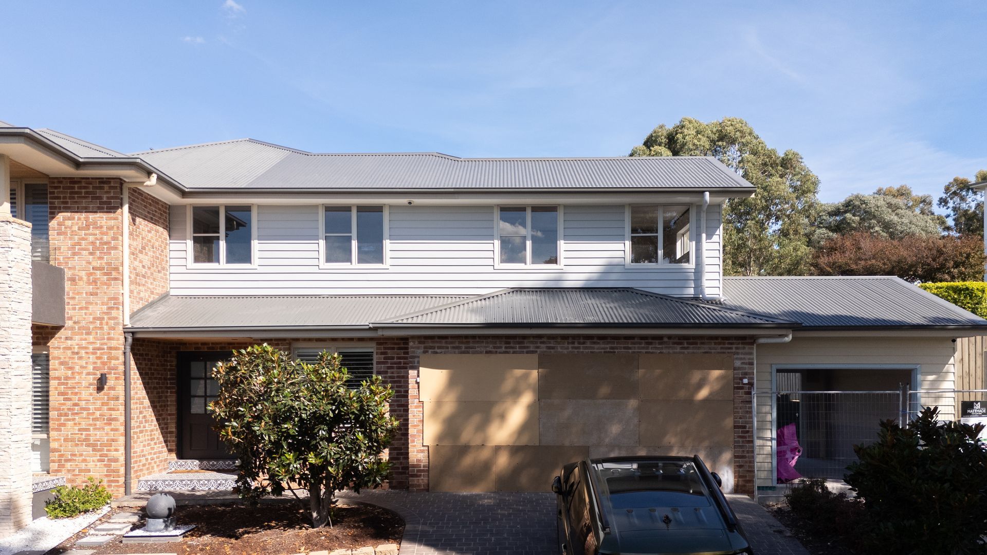 Two-story Suburban House With Brick and a Car in the Driveway — Matt Made Building in Camden, NSW