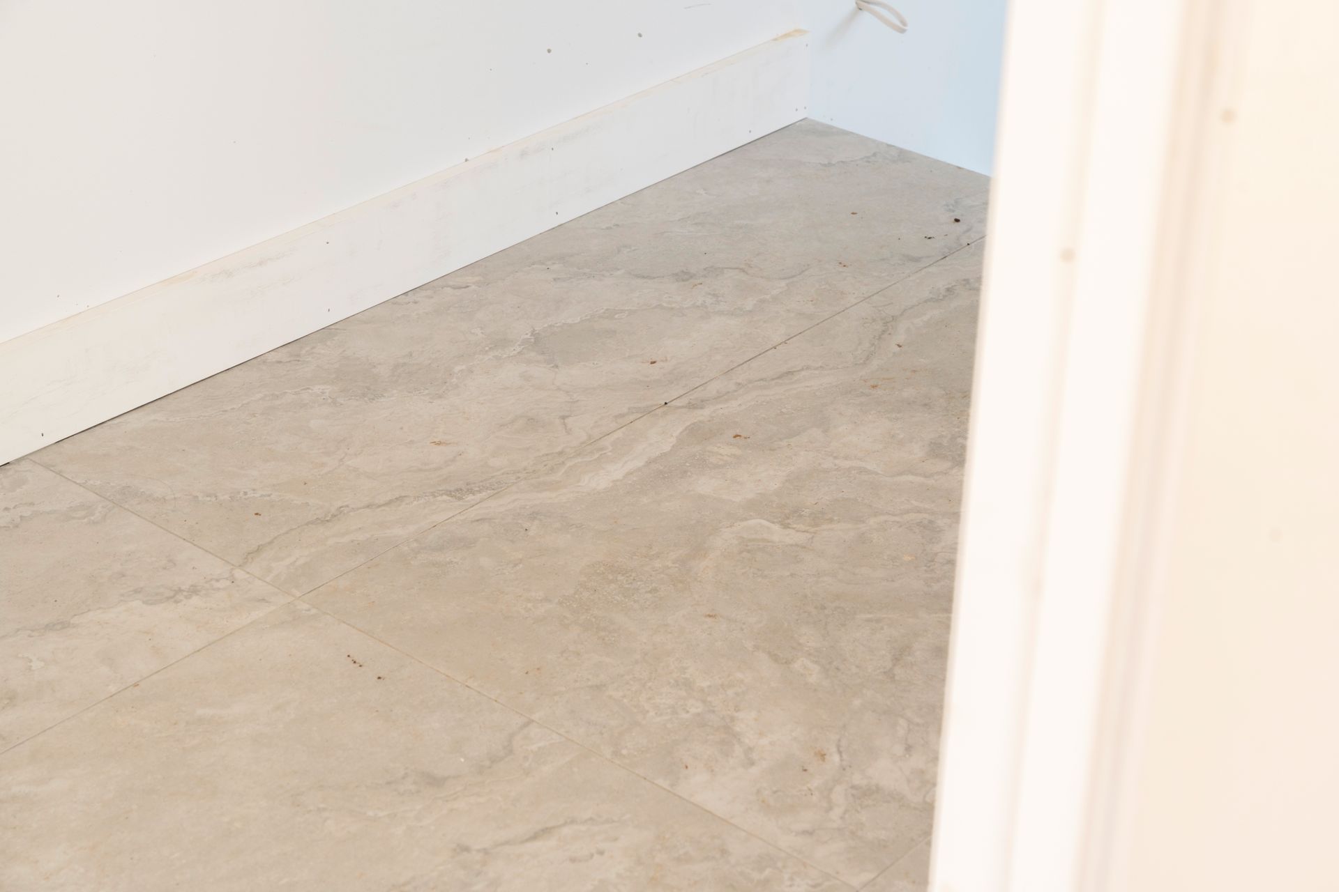 Empty White Room With Bare Concrete Floor and Baseboards — Matt Made Building in Camden, NSW