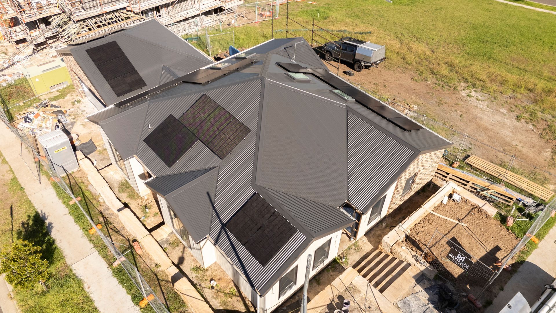 Aerial View of a Modern House With a Dark Roof Under Construction — Matt Made Building in Camden, NSW