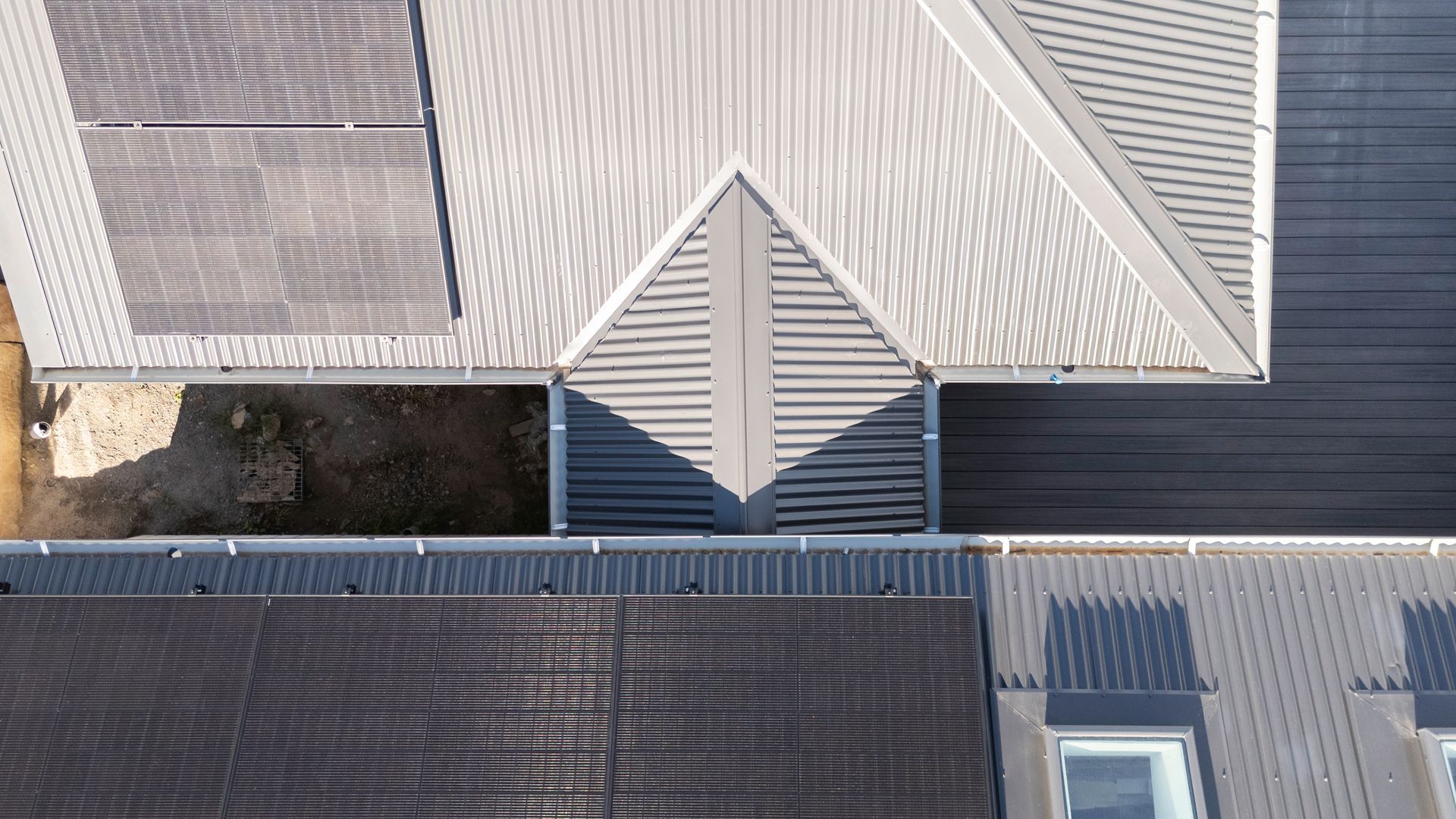 Aerial View of Modern House Roofs With Gray Metal Panels — Matt Made Building in Camden, NSW