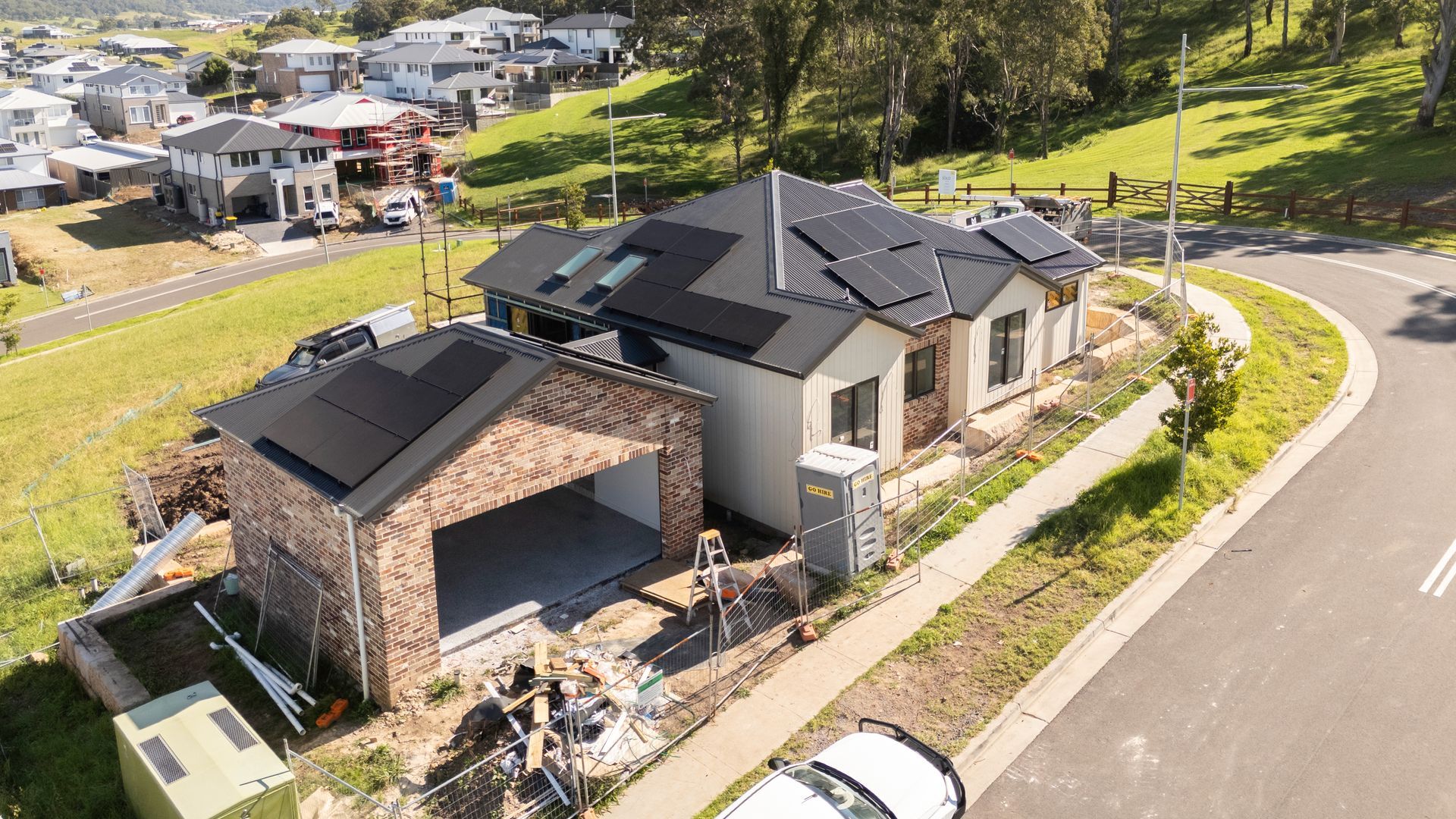 Aerial View of a Modern House With a Black Roof and Stone Garage — Matt Made Building in Camden, NSW