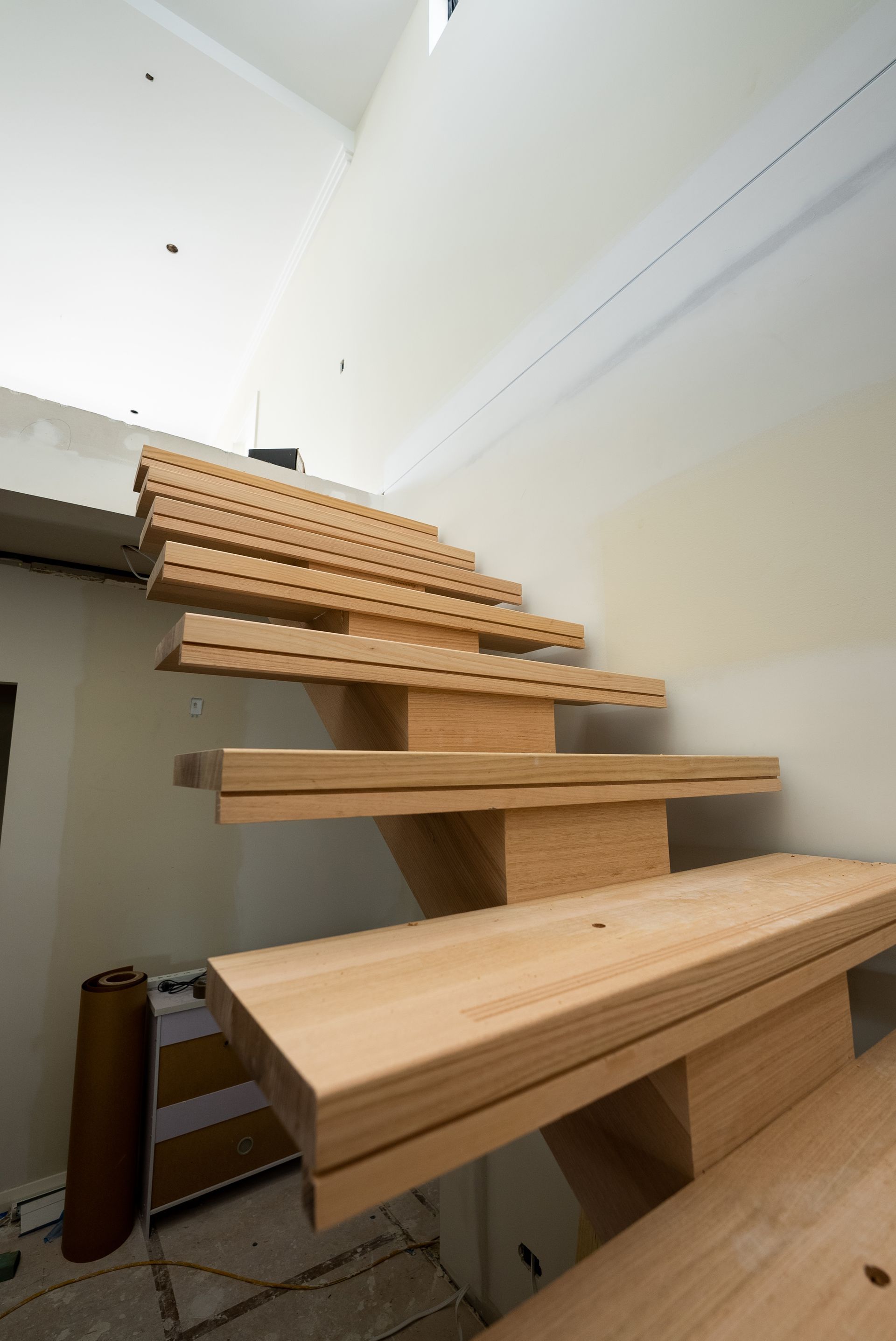 Wooden Stair Treads Under Construction in a Narrow Indoor Staircase — Matt Made Building in Camden, NSW