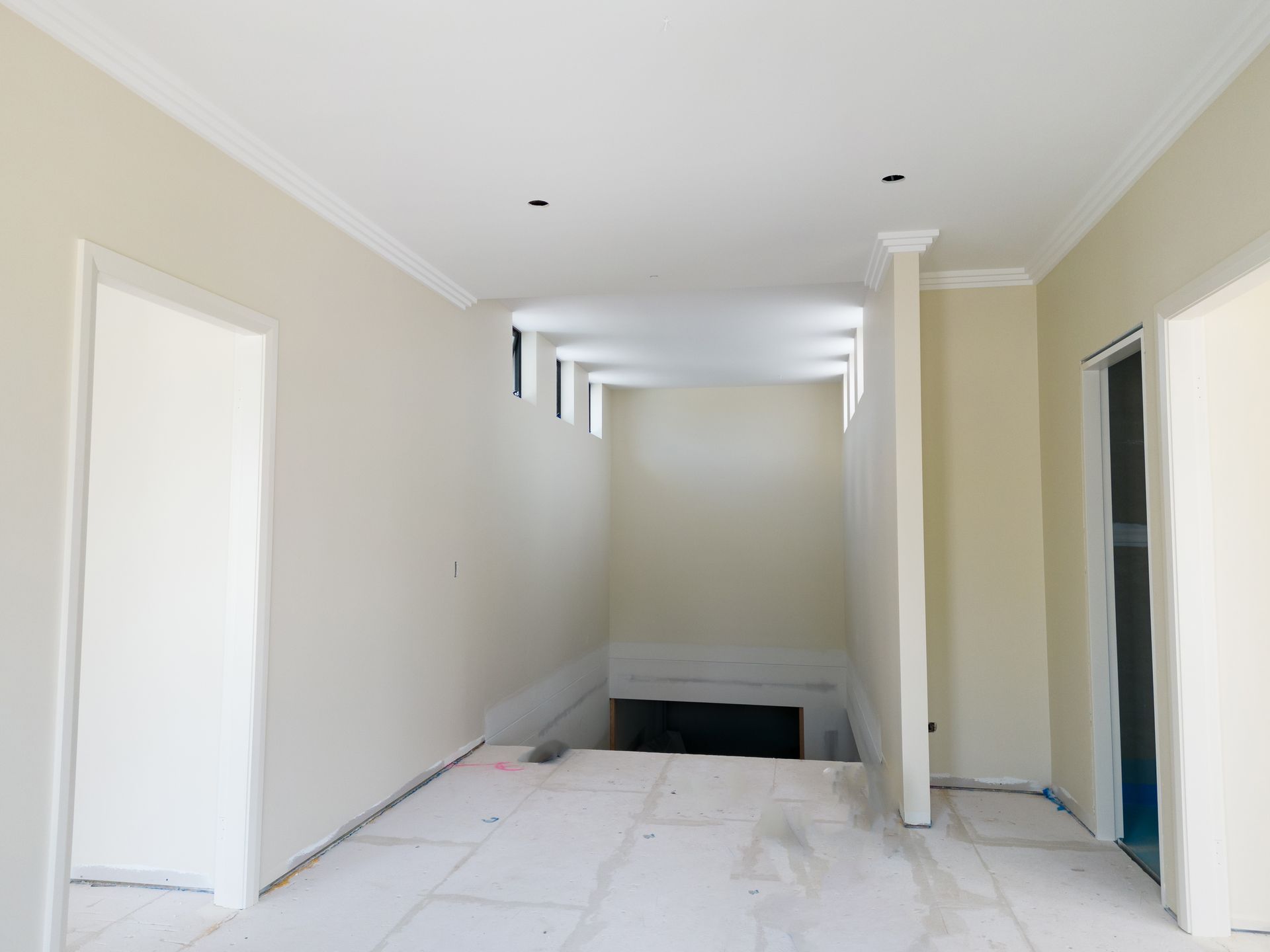 Empty Narrow Hallway Under Construction With White Walls — Matt Made Building in Camden, NSW