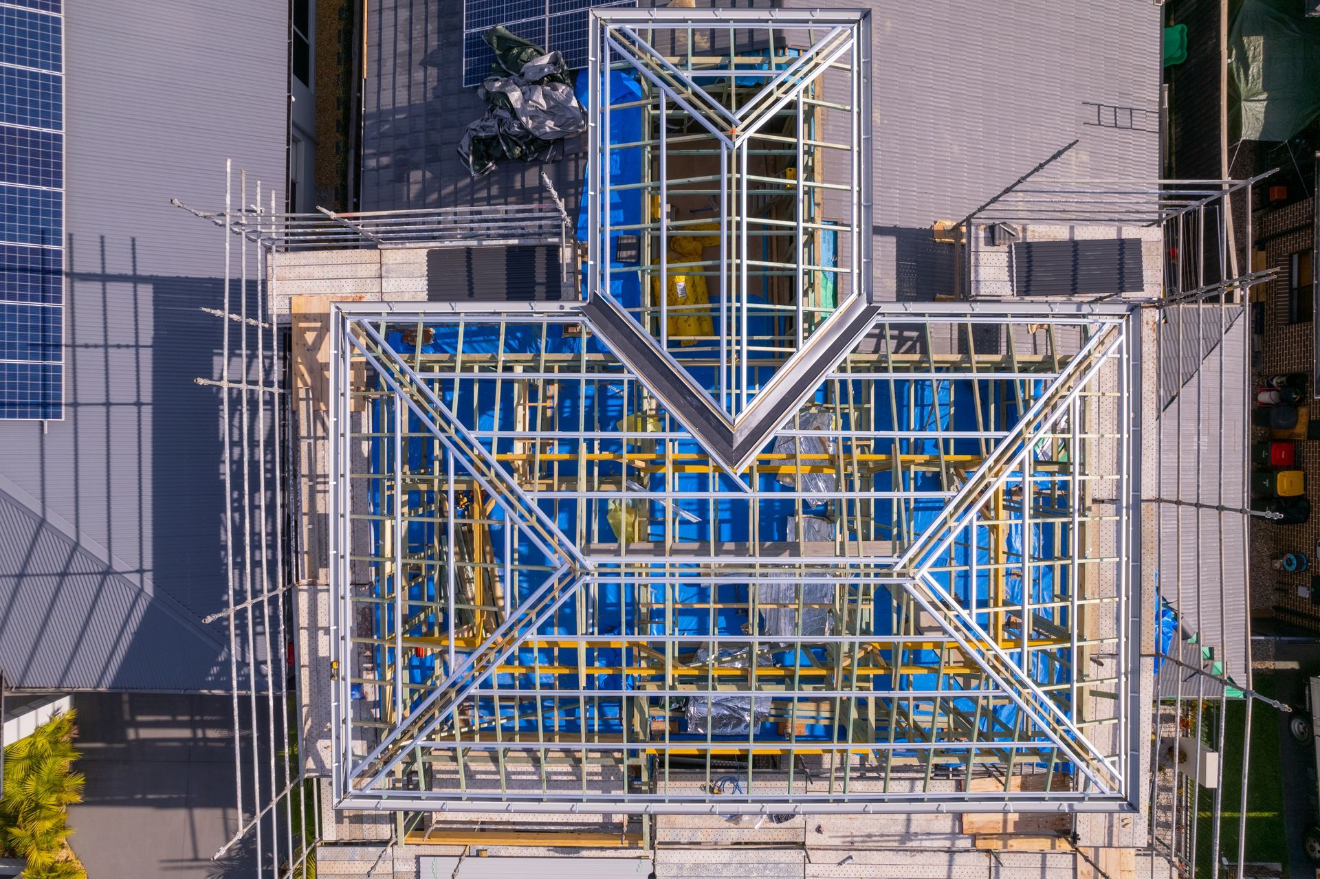 Aerial View of a Building Roof With Blue Metal Framing and a Central Skylight Structure — Matt Made Building in Camden, NSW
