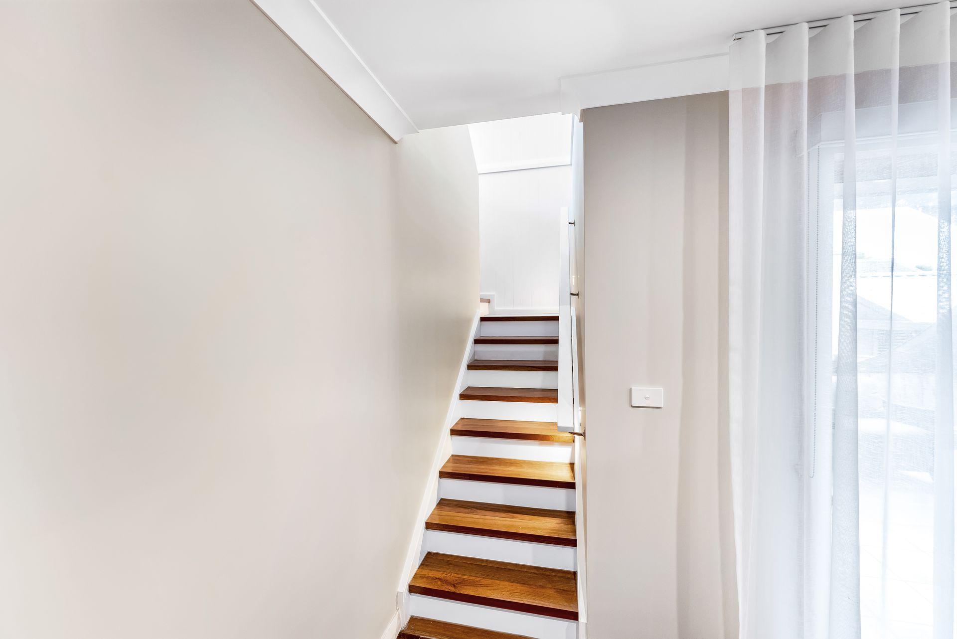 Narrow Indoor Staircase With White Walls and Sheer Curtains — Matt Made Building in Camden, NSW
