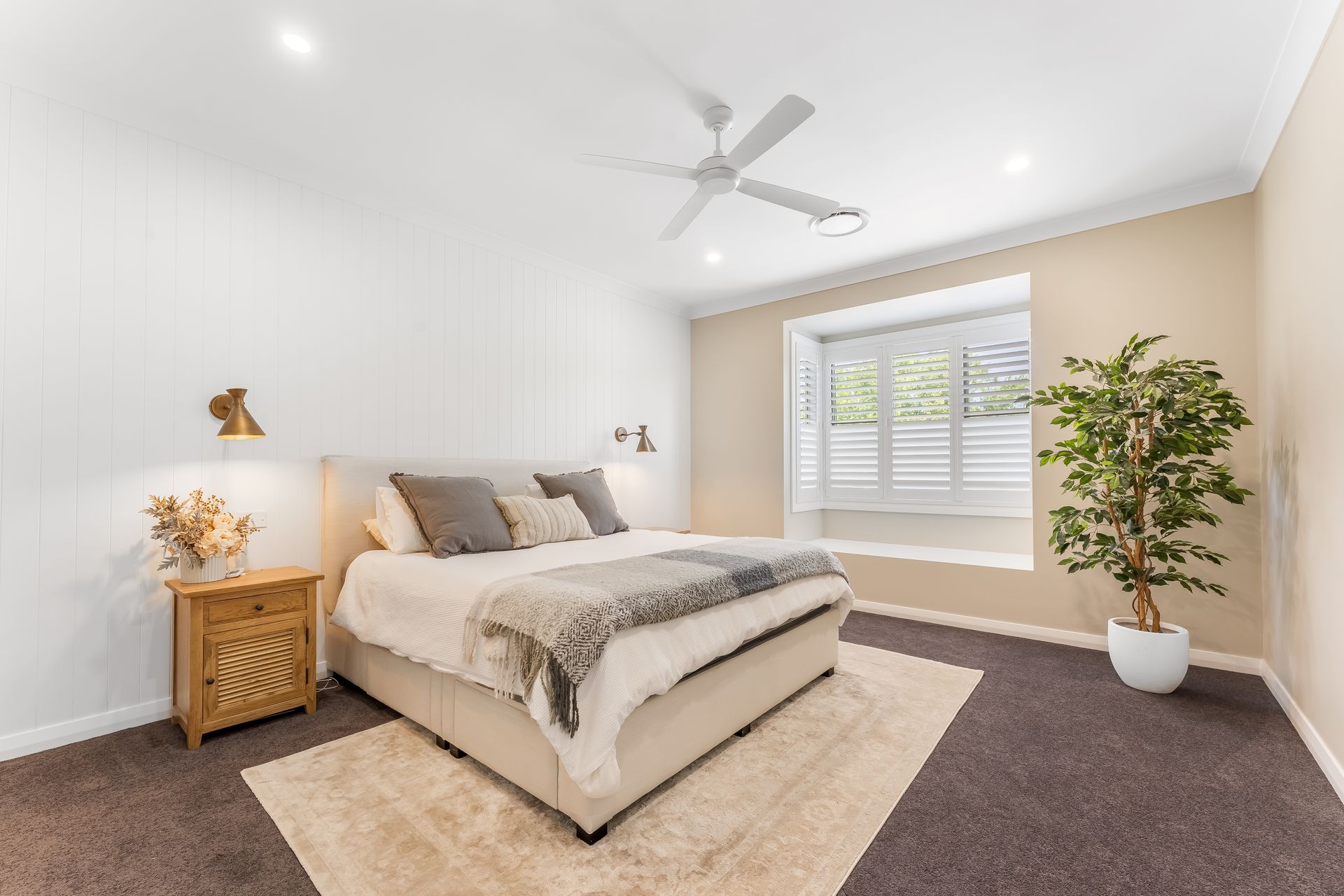 Bright Modern Bedroom With White Walls and Potted Plant — Matt Made Building in Camden, NSW