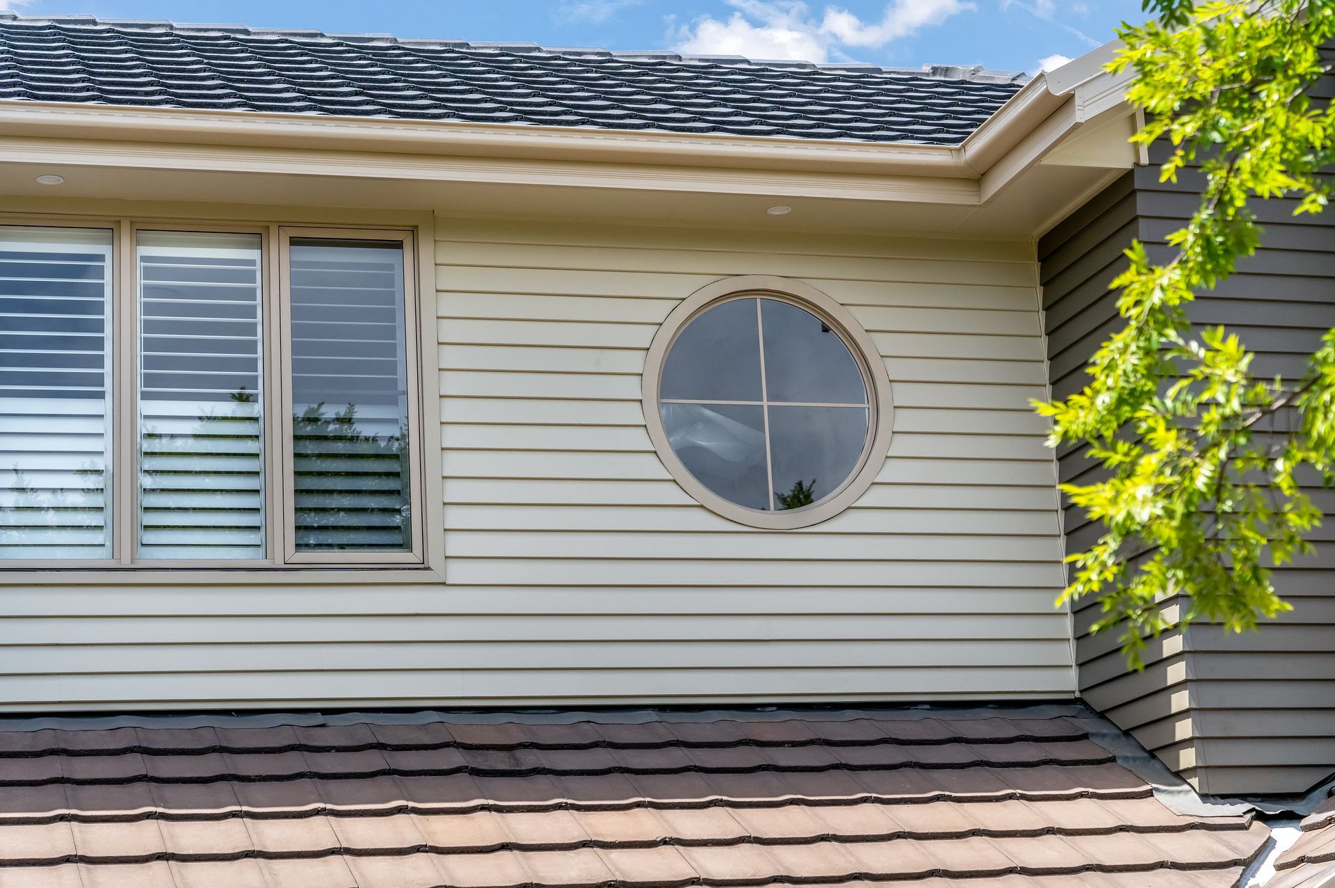 House Exterior With Beige Siding, White Shutters and a Shingled Roof — Matt Made Building in Camden, NSW