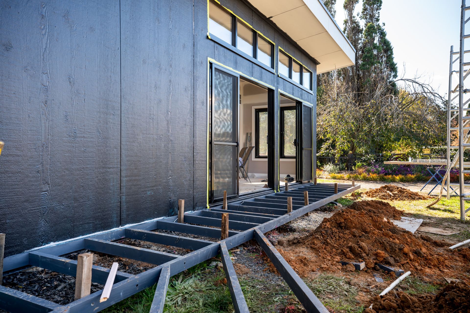 New Building Exterior With Exposed Steel Framing and Large Glass Doors — Matt Made Building in Camden, NSW