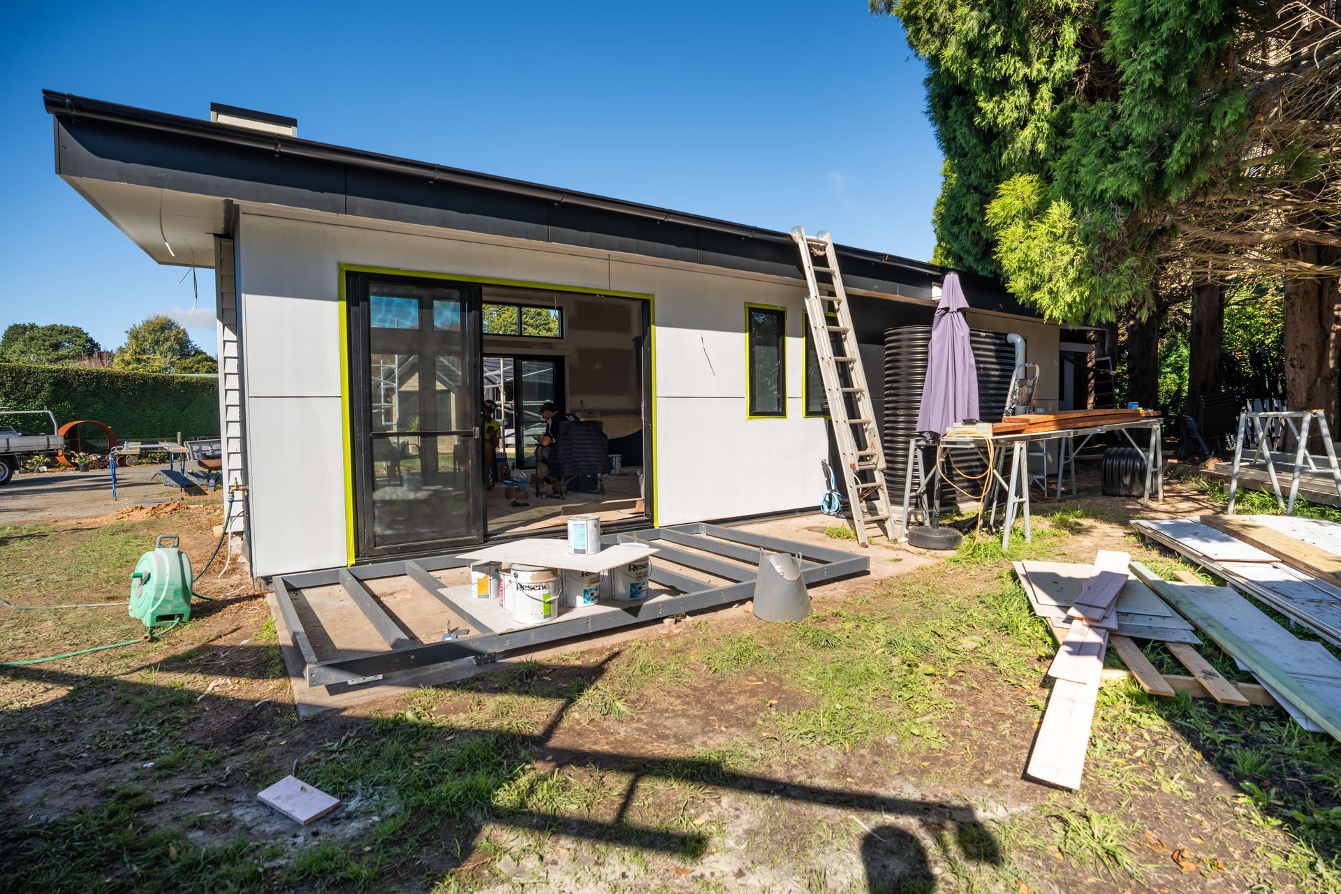 Small Modern House With Open Patio Doors and Construction Materials — Matt Made Building in Camden, NSW