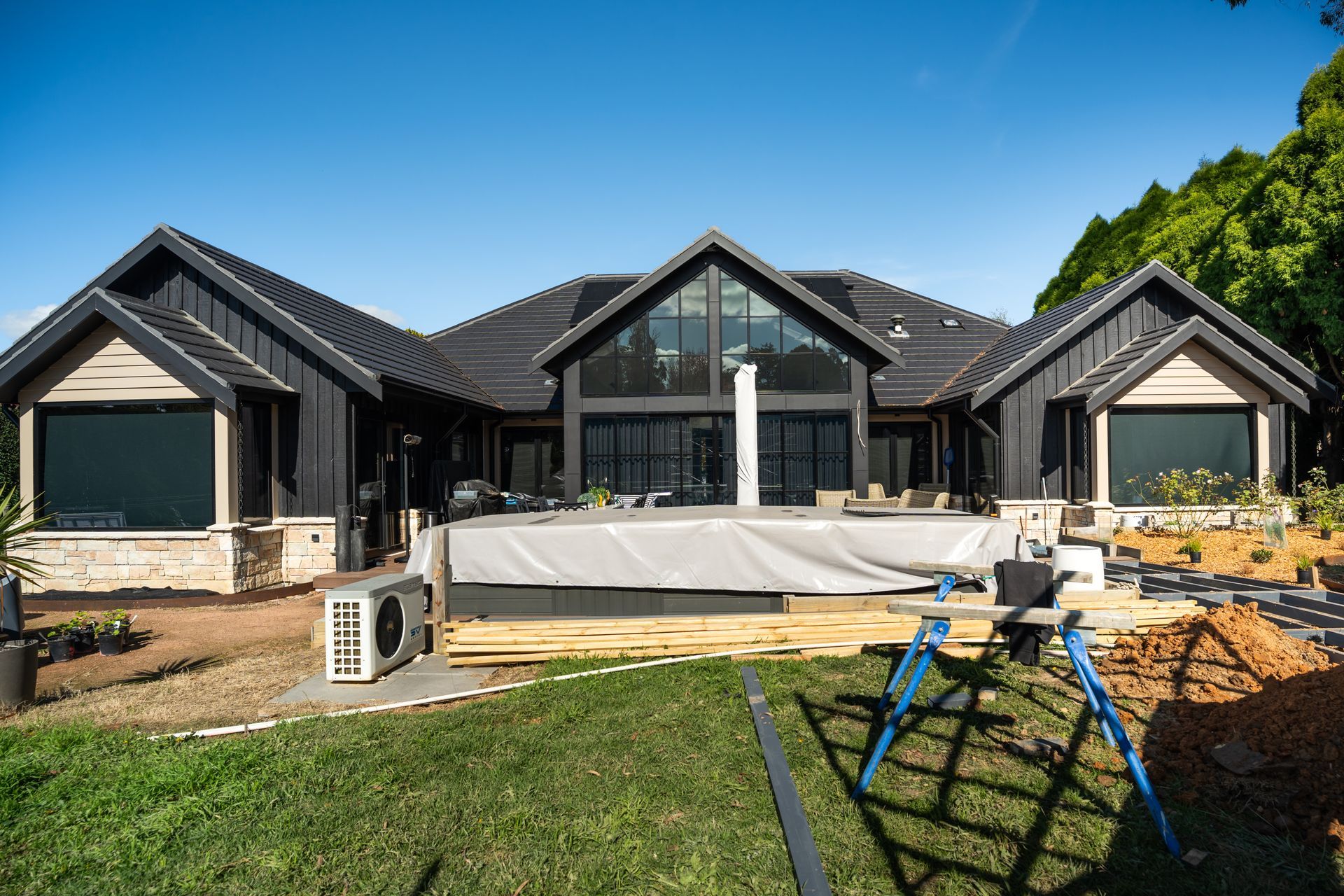 Modern House Under Construction With Dark Roof and Covered Pool — Matt Made Building in Camden, NSW