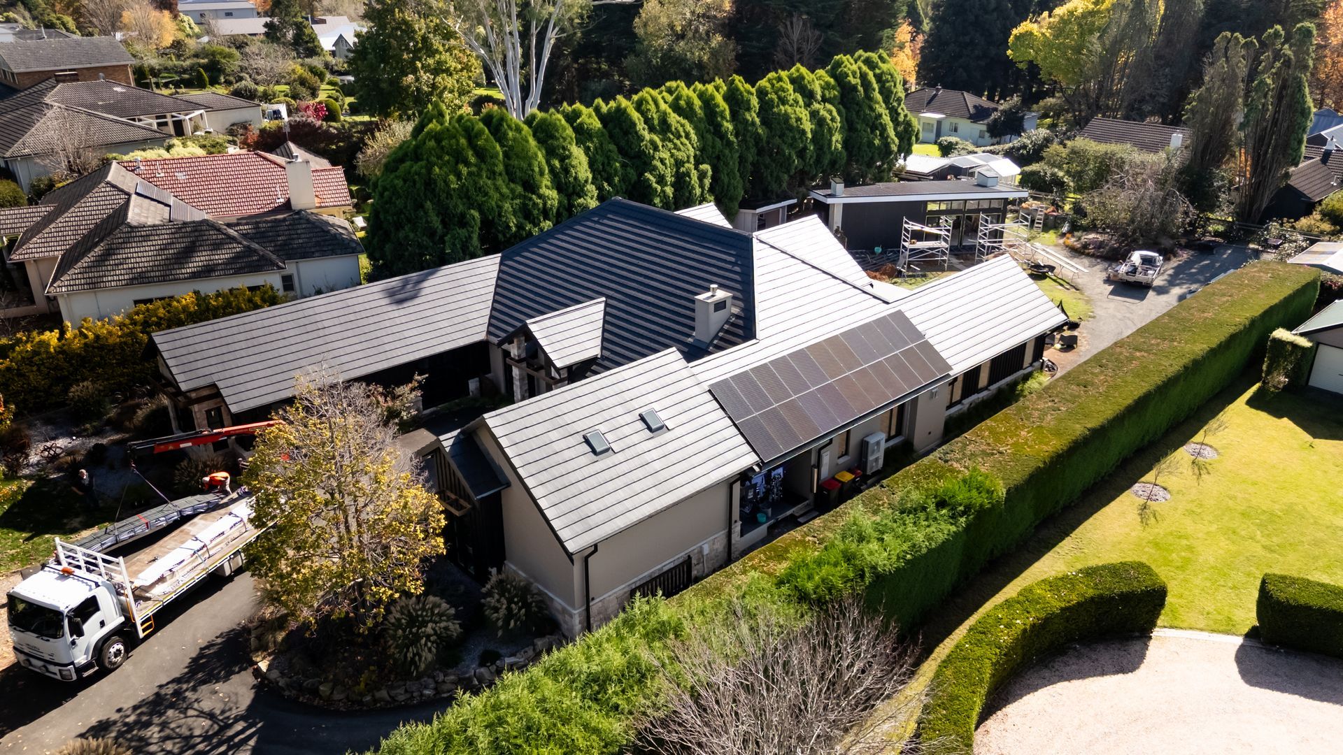 Aerial View of a House With Solar Panels and Surrounding Trees — Matt Made Building in Camden, NSW