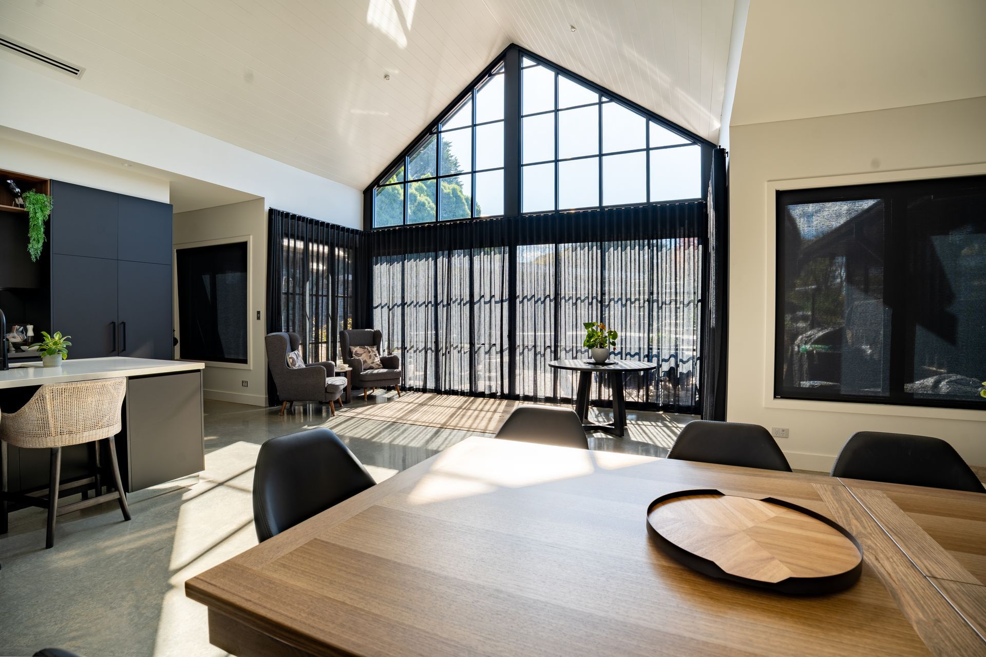 Bright Modern Dining Room With Large Black-framed Windows — Matt Made Building in Camden, NSW