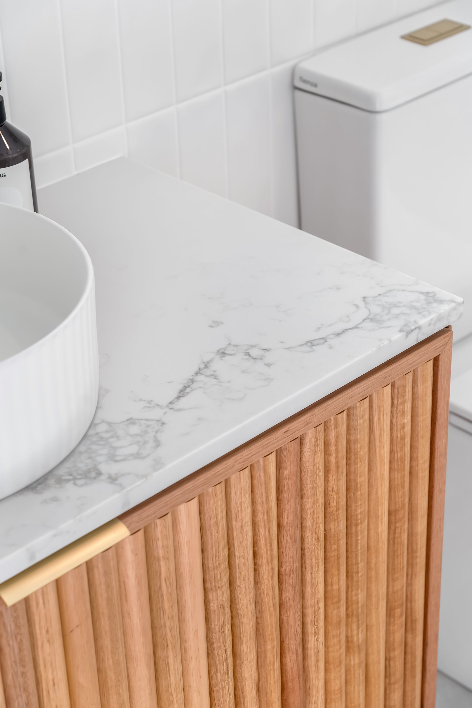 Bathroom Vanity With White Marble Countertop and Wood Cabinet — Matt Made Building in Camden, NSW