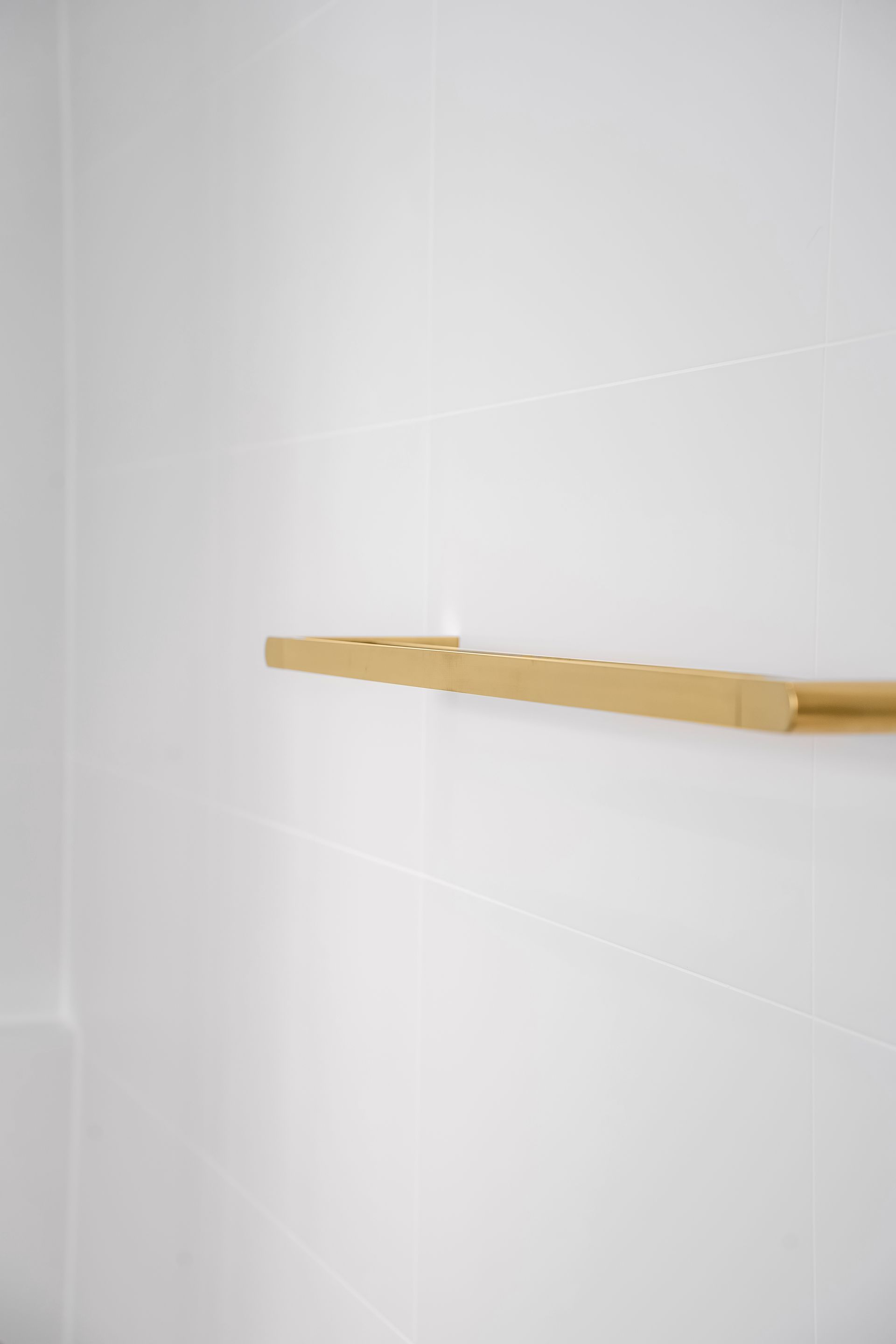 Wooden Shelf Mounted on a White Tiled Wall in a Bathroom — Matt Made Building in Camden, NSW