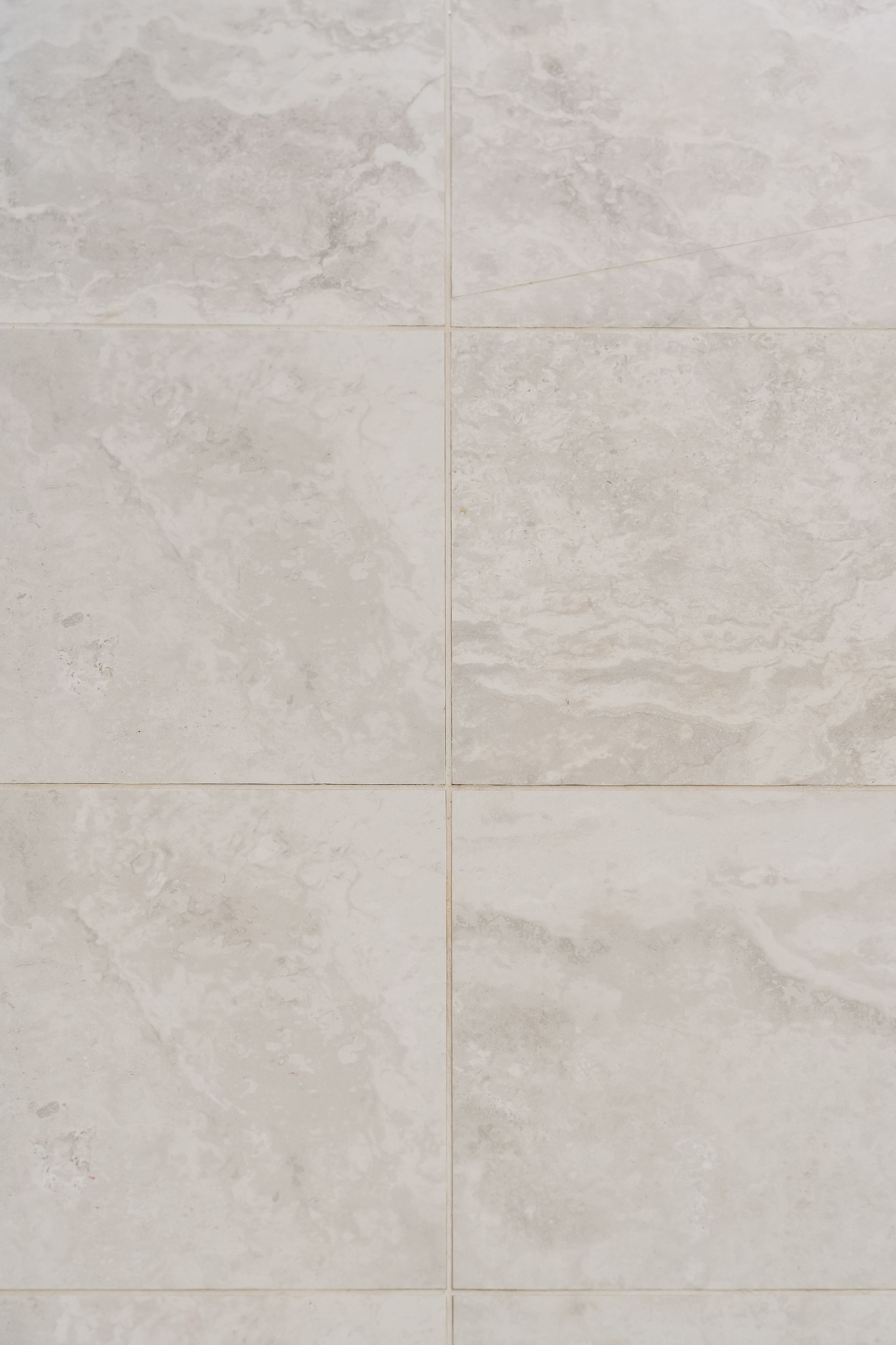 Light Beige Stone Tile Wall With Subtle Grout Lines and Textured Surface — Matt Made Building in Camden, NSW
