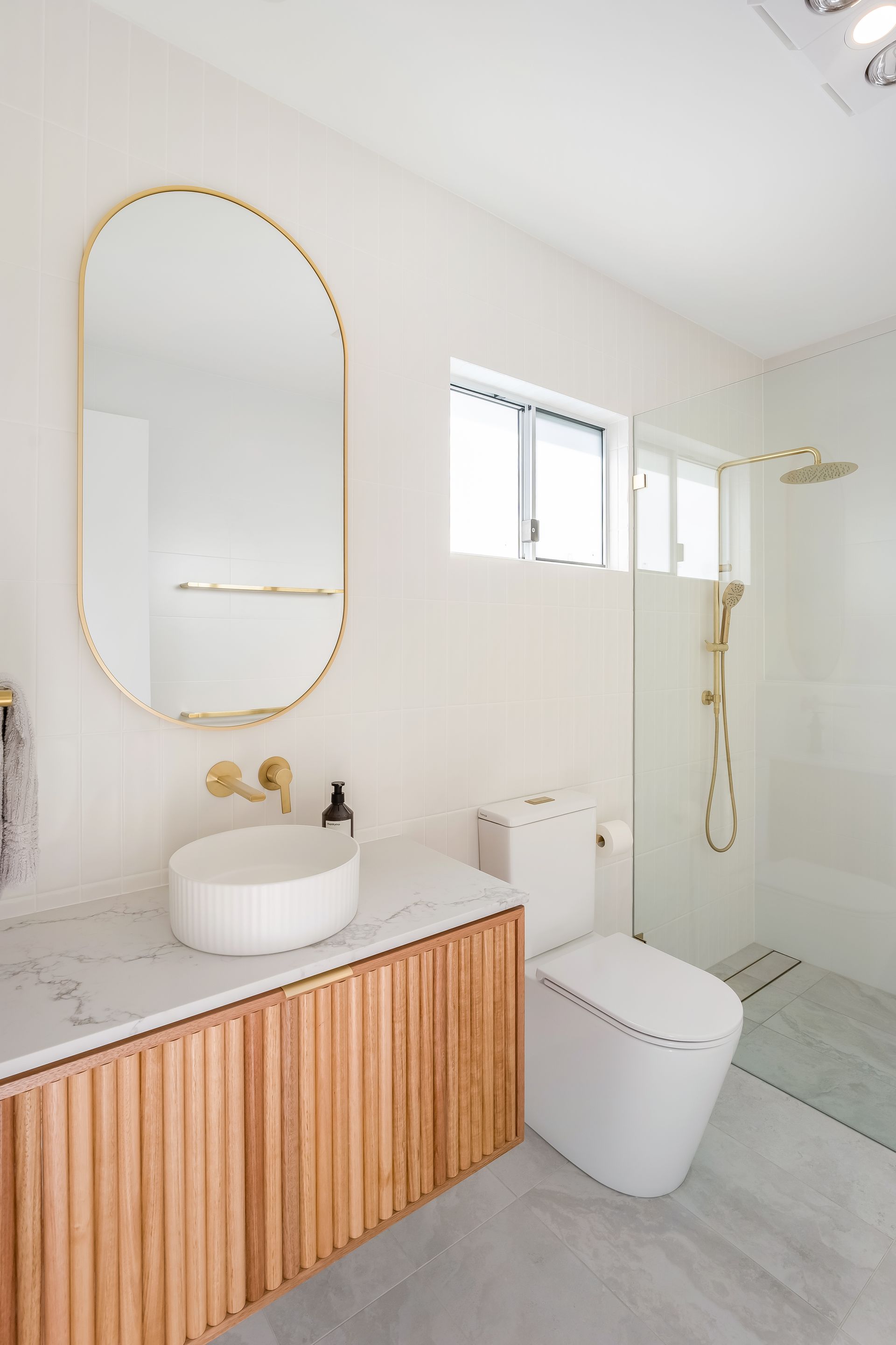 Modern Bathroom With Wood Vanity and Shower Near a Window — Matt Made Building in Camden, NSW