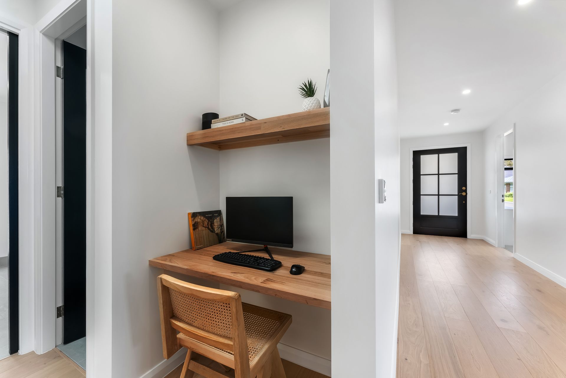 Small Home Office Nook With Wooden Desk and Shelf in a Bright Hallway — Matt Made Building in Camden, NSW