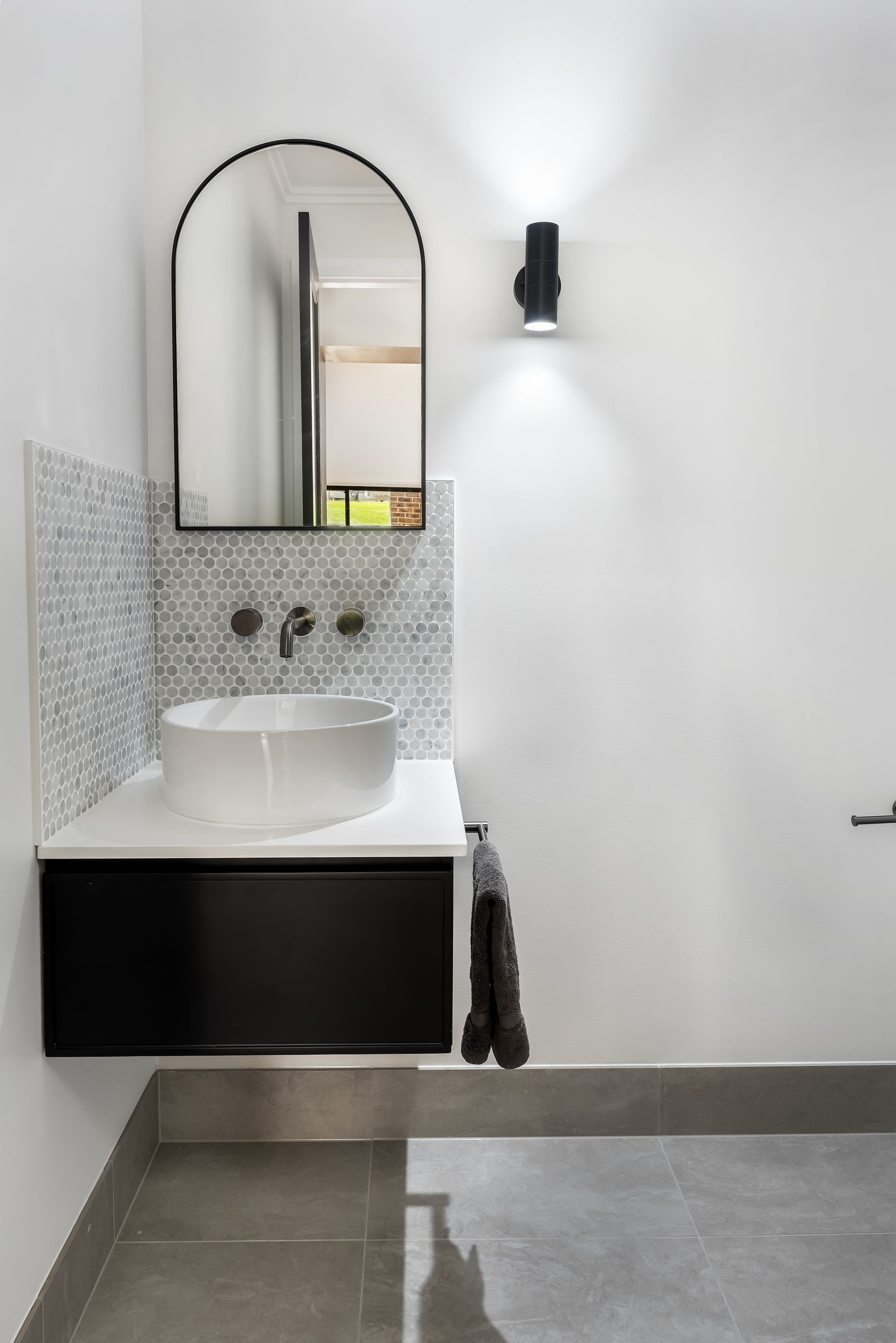 Modern Bathroom Vanity With Round Sink and Wall Sconce — Matt Made Building in Camden, NSW