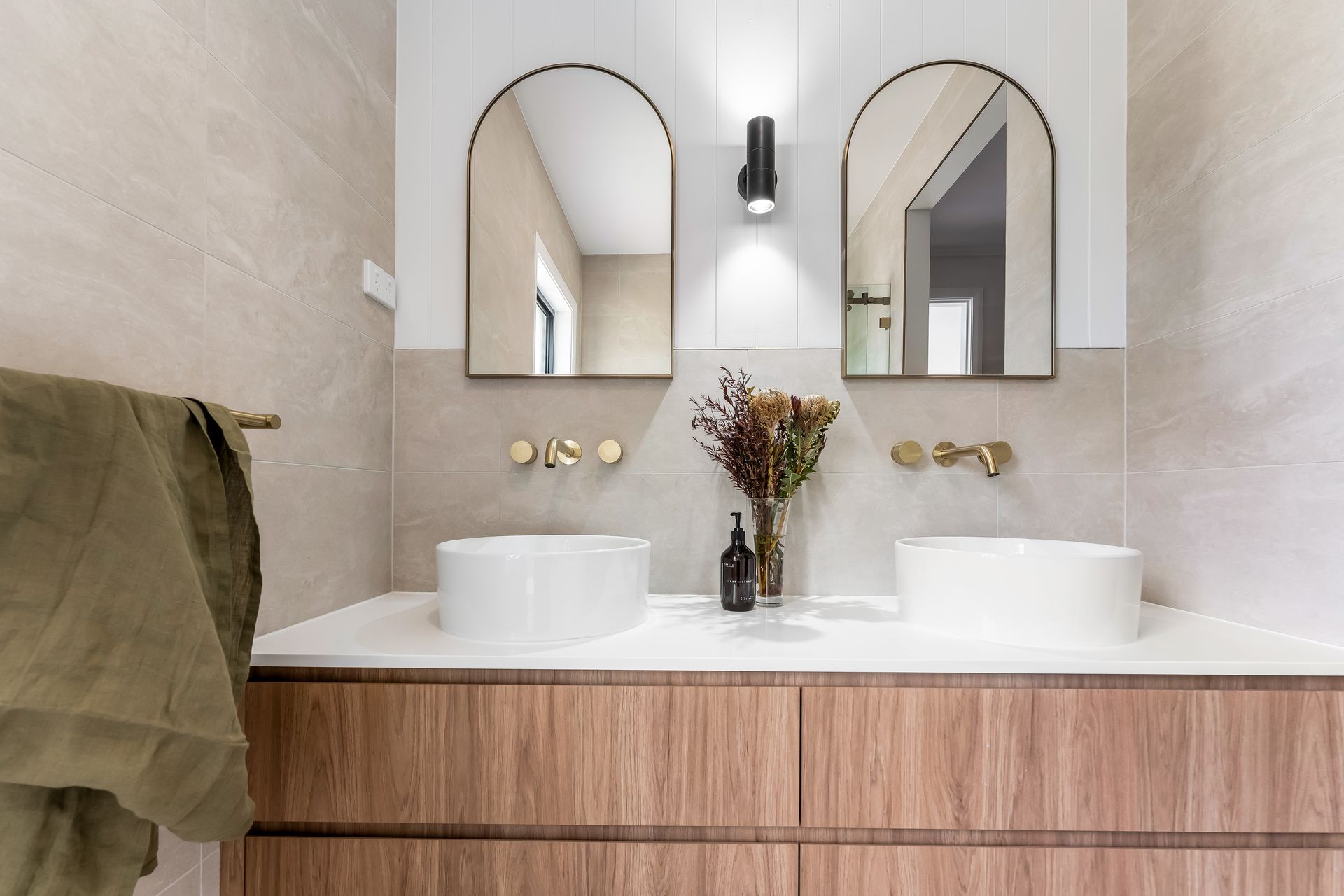 Modern Bathroom Vanity With Double Sinks and a Vase of Dried Flowers — Matt Made Building in Camden, NSW