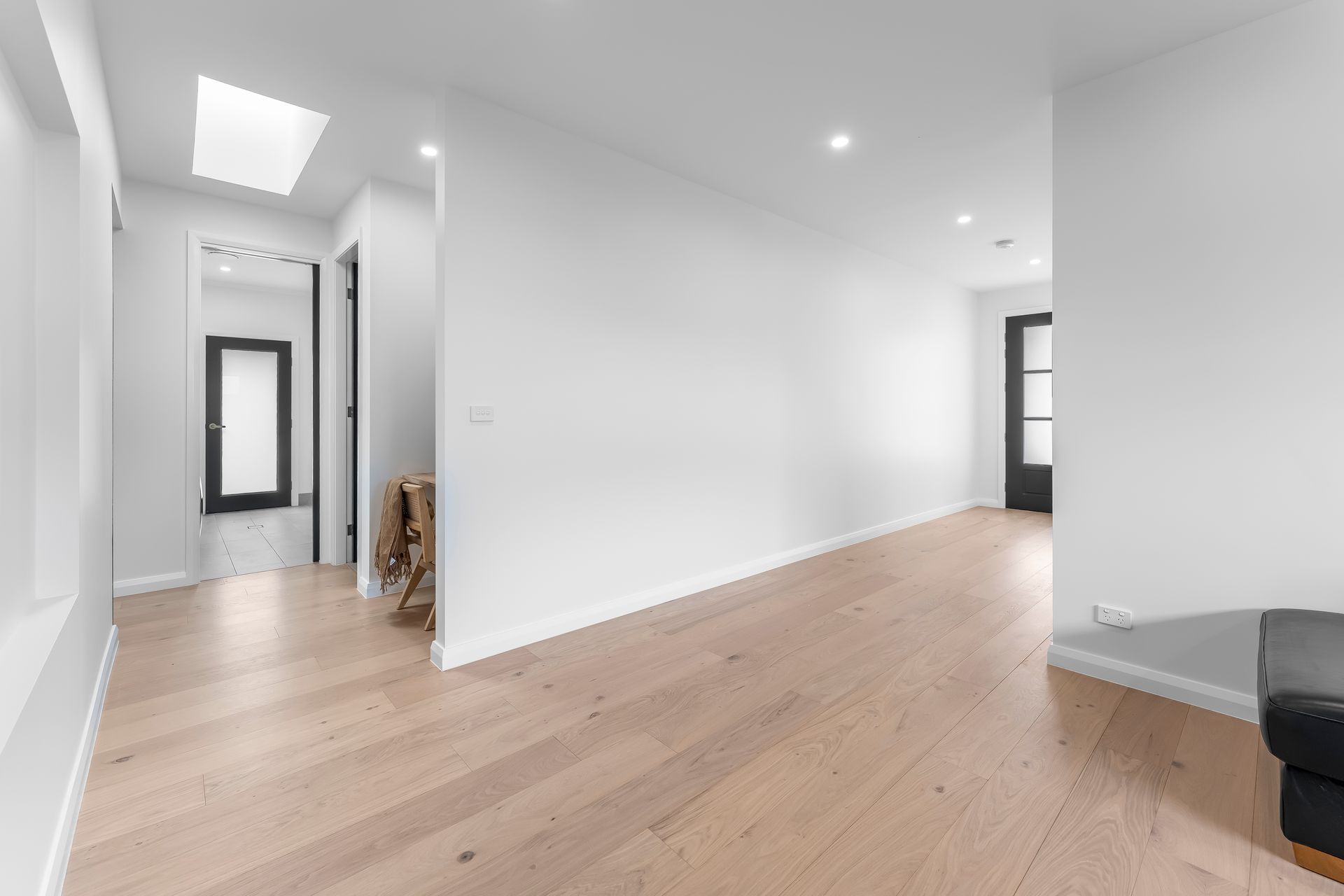 Bright Empty Hallway With White Walls and Recessed Ceiling Lights — Matt Made Building in Camden, NSW