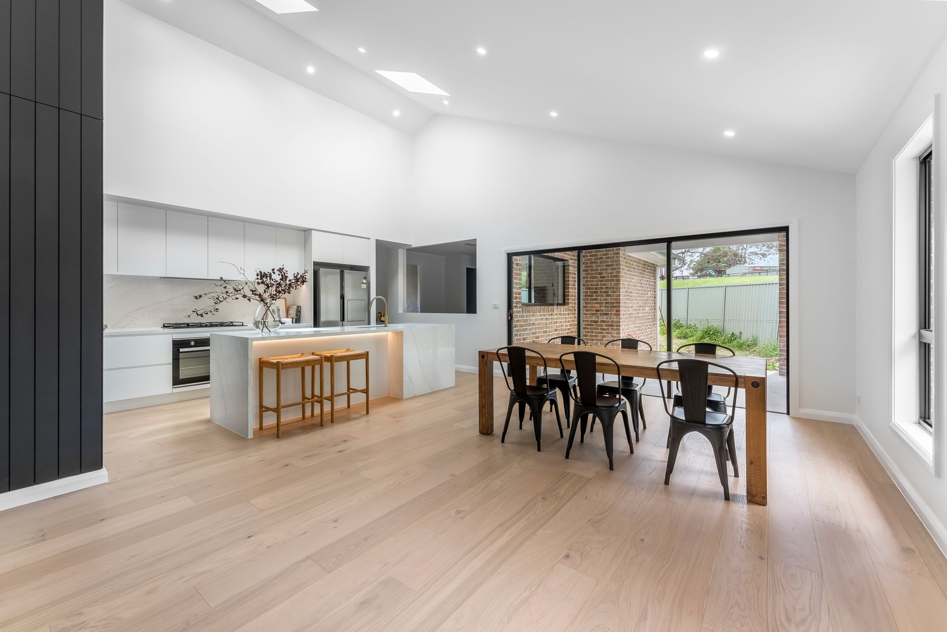 Bright Open-plan Kitchen and Dining Area With Light Wood Floors — Matt Made Building in Camden, NSW