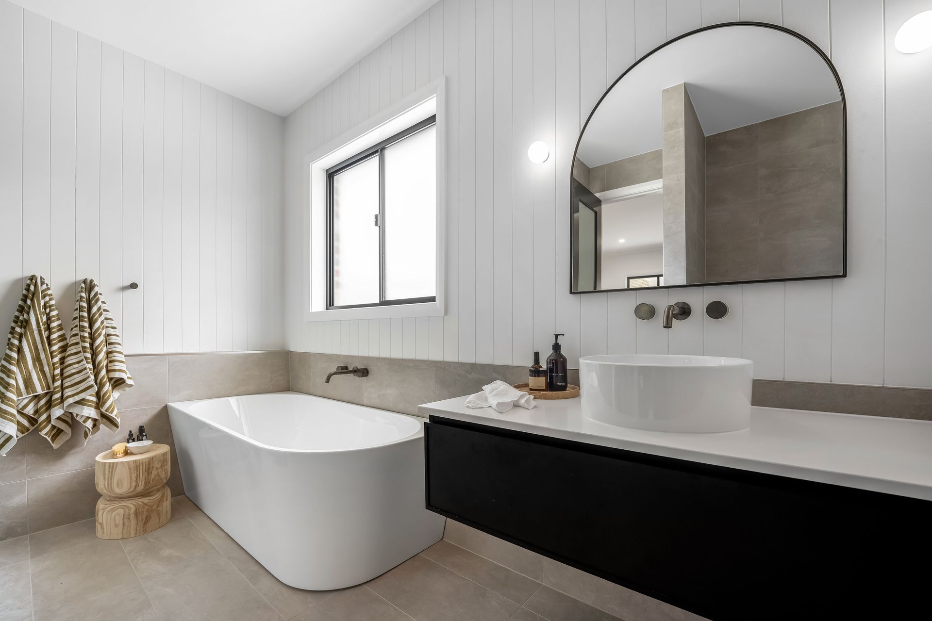 Modern Bathroom With Freestanding Tub and Striped White Walls — Matt Made Building in Camden, NSW