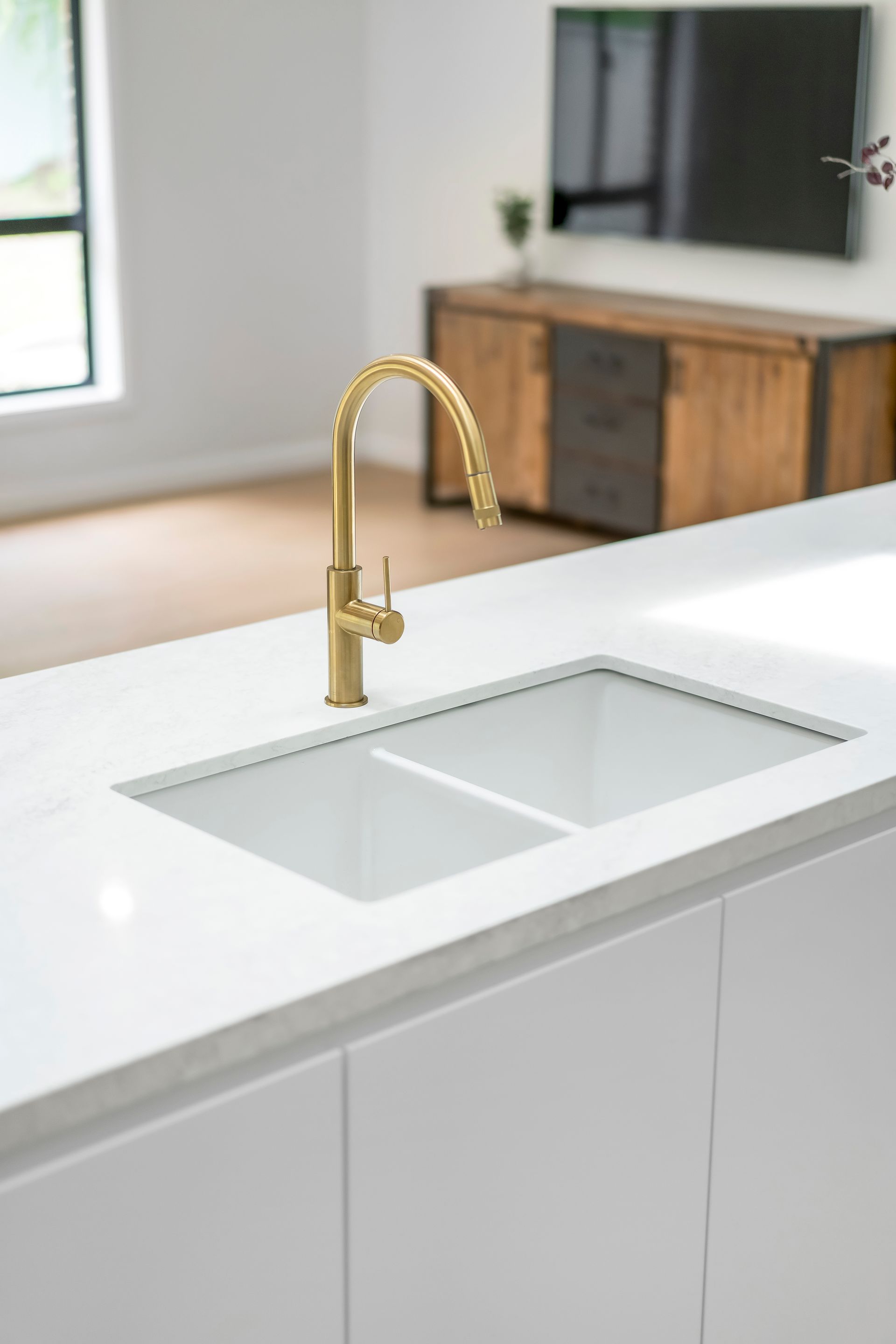 Modern Kitchen Island With White Countertop and Built-in Sink — Matt Made Building in Camden, NSW