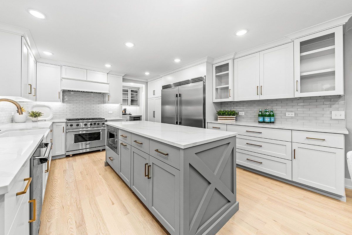 There is a large island in the middle of the kitchen.