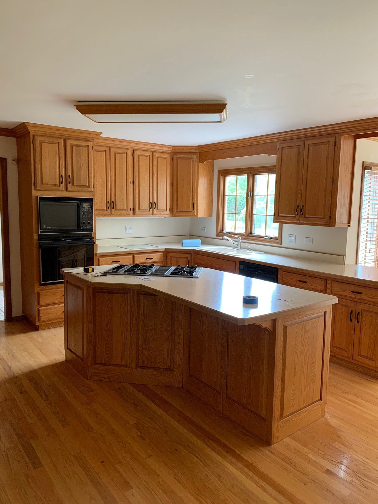 There is a large island in the middle of the kitchen.