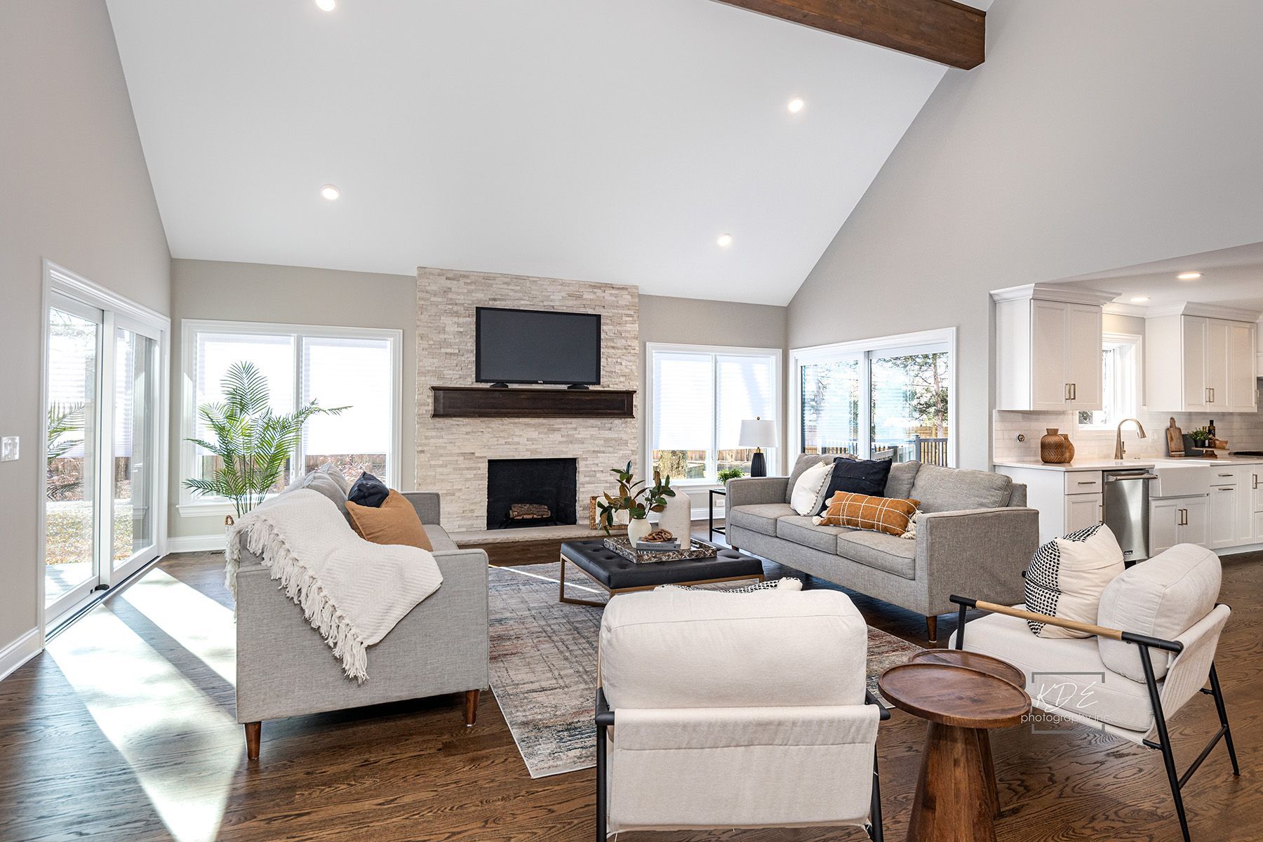 A living room filled with furniture and a fireplace.