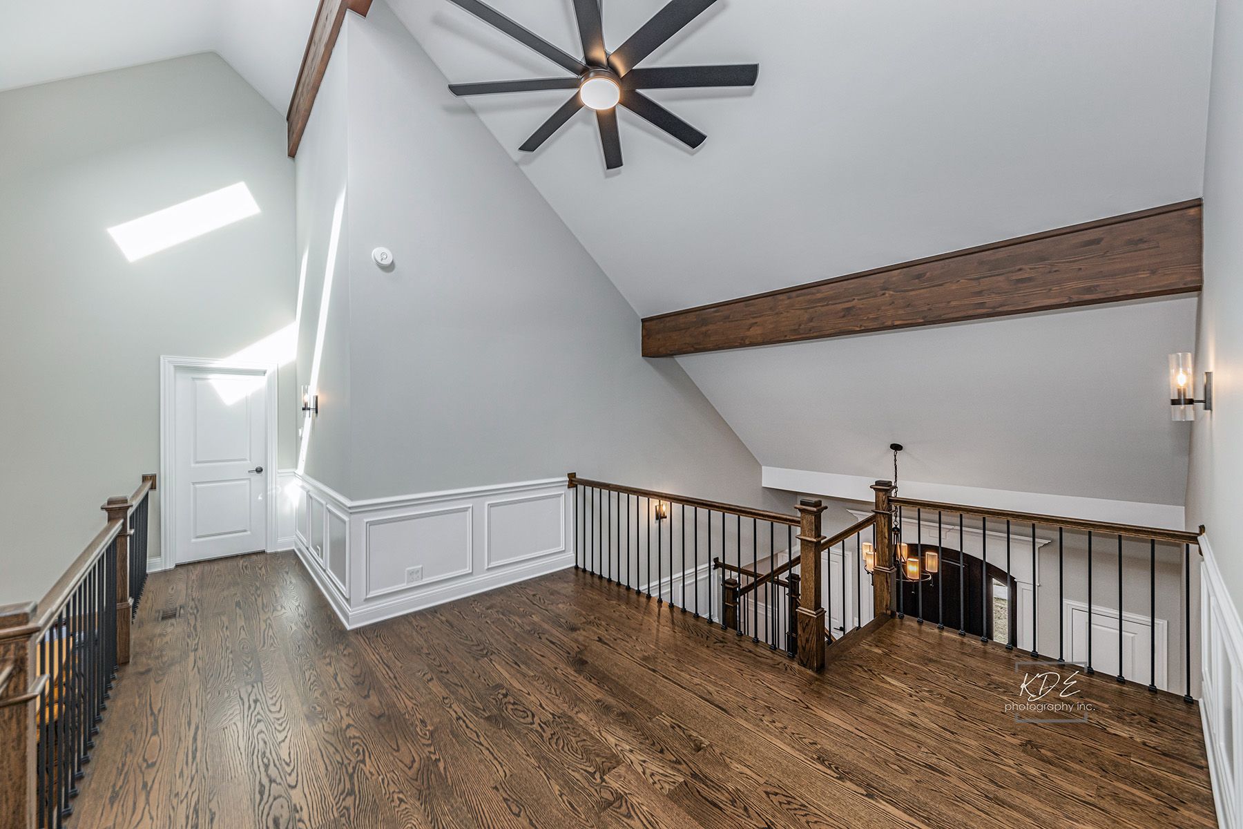 There is a ceiling fan in the corner of the room.