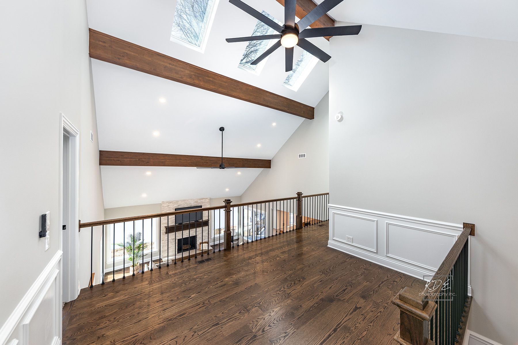 There is a ceiling fan in the corner of the room.
