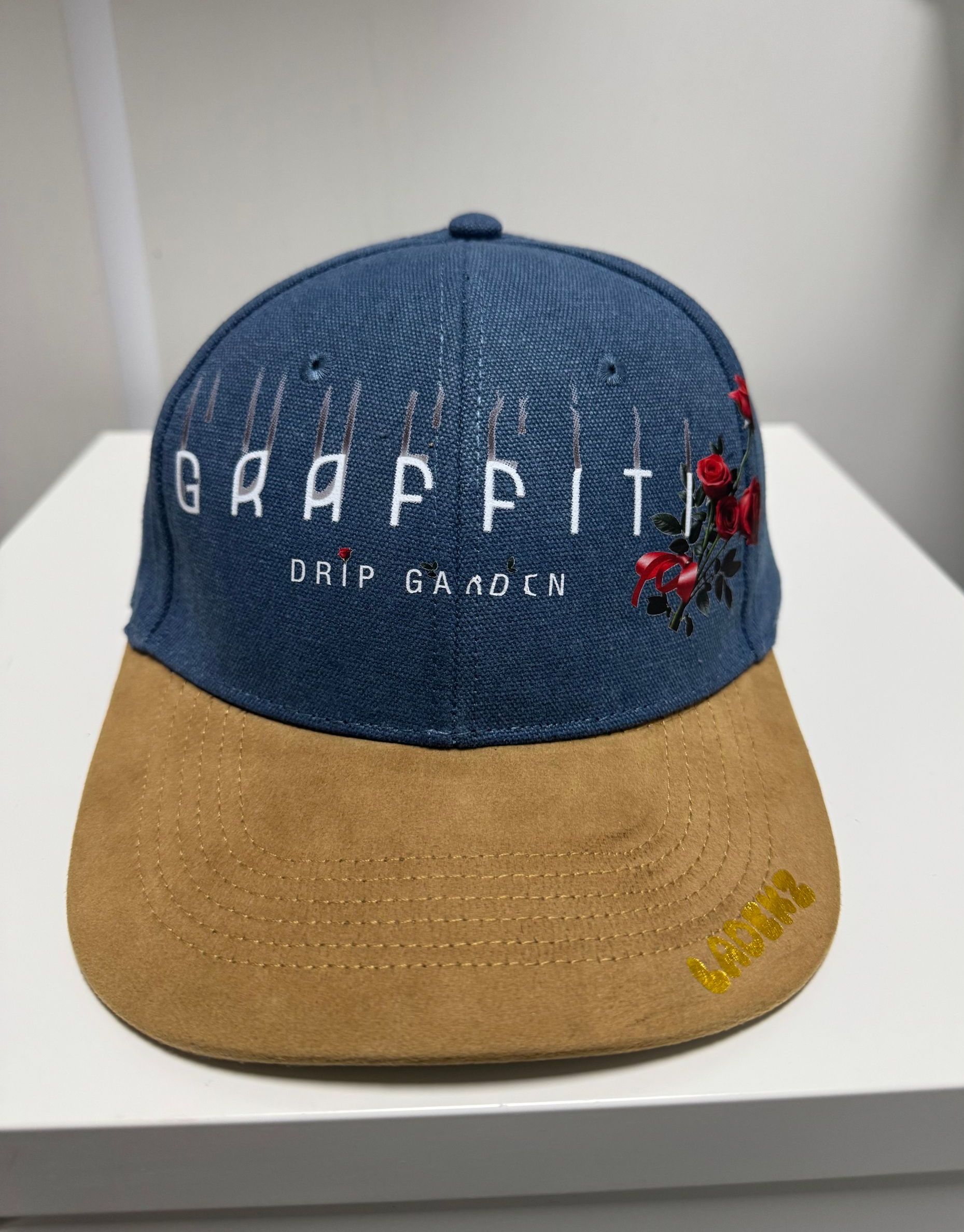Blue and tan baseball cap with 