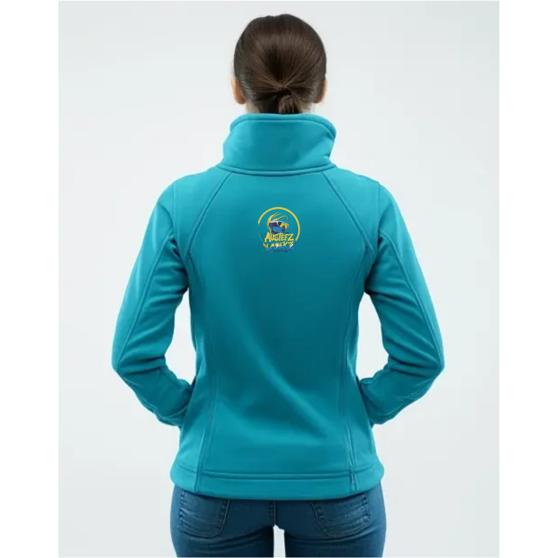 Woman wearing a teal jacket with a colorful futuristic graphic, smiling.
