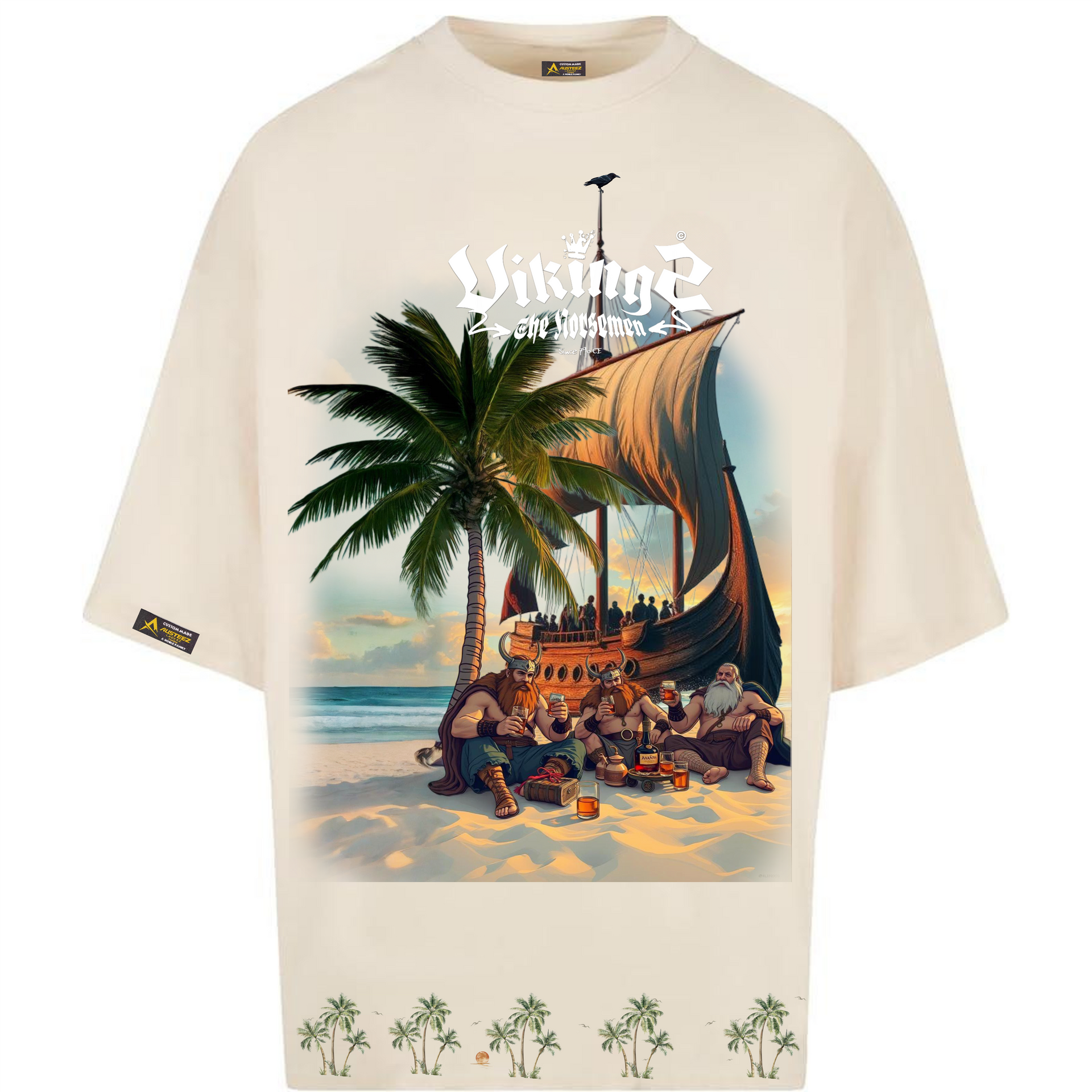 Cream t-shirt with a Viking ship on a beach scene, palm trees, and the word