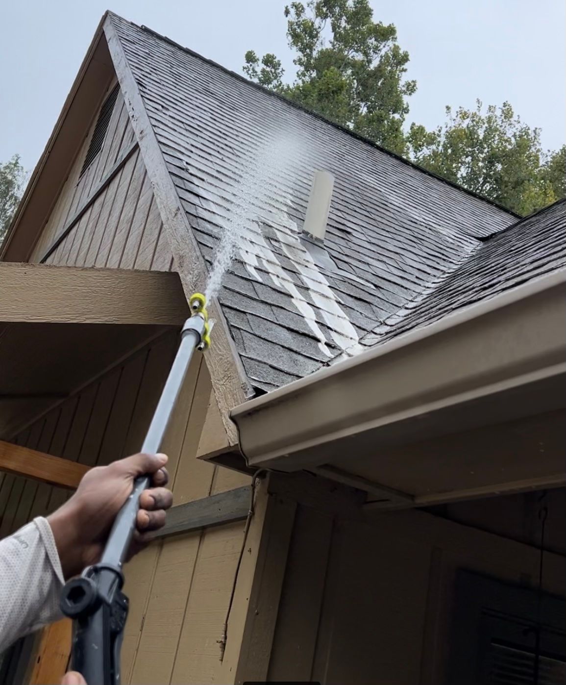 Roof cleaning with high pressure cleaner