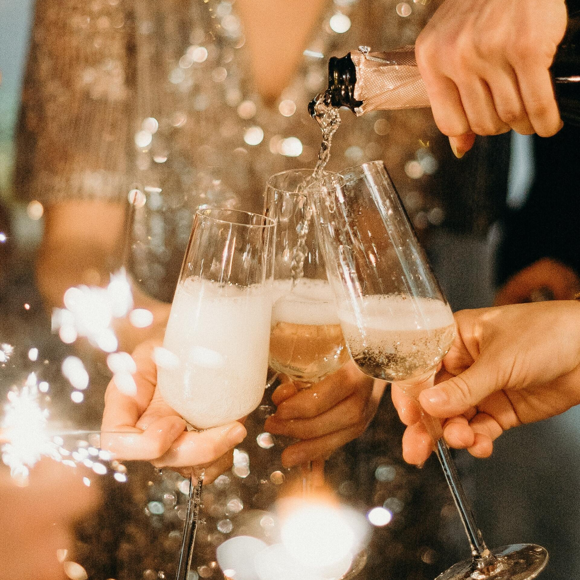 pouring champagne at a holiday party at CrystalView