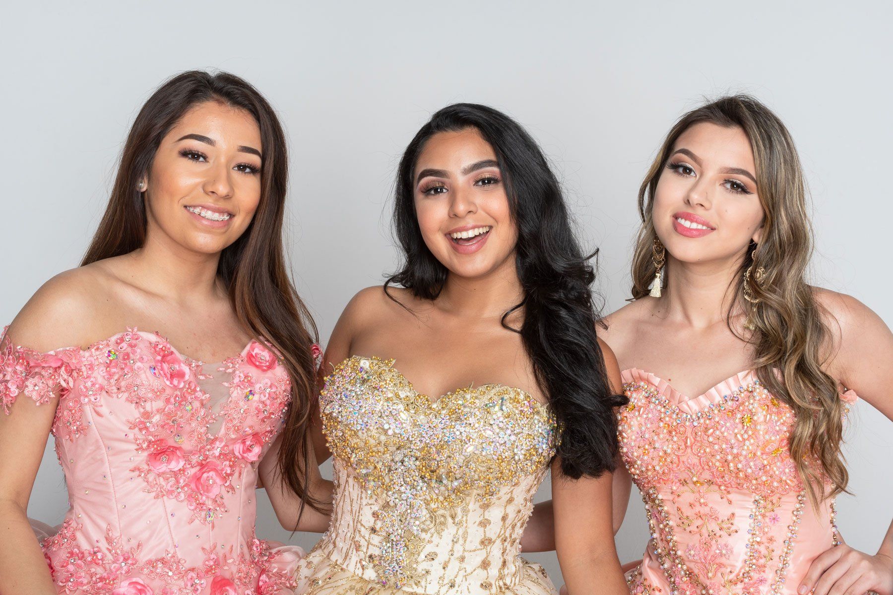 three girls in dresses