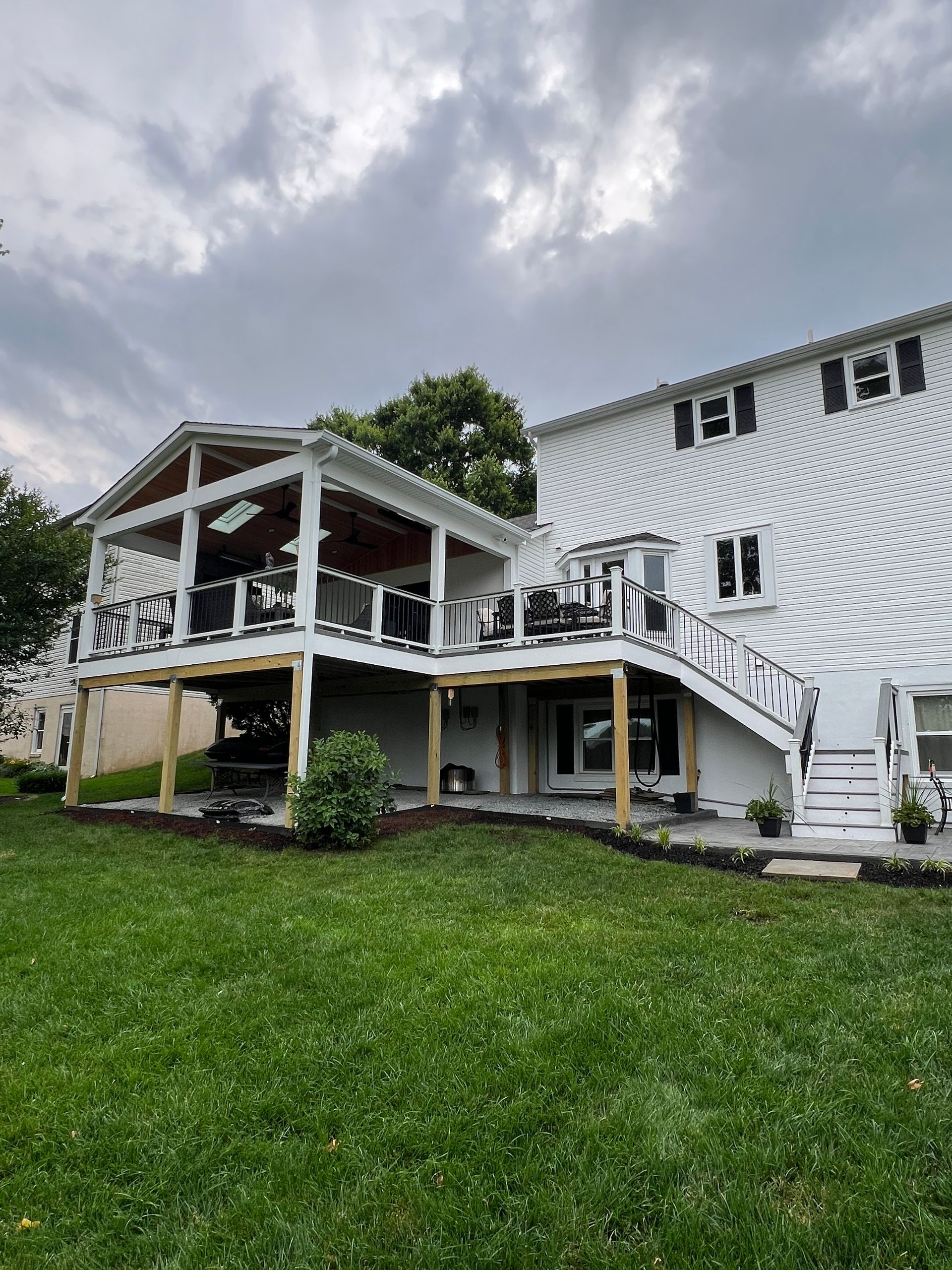 Trex Open Porch with Heaters and Stamped Concrete patio in Leesburg, VA