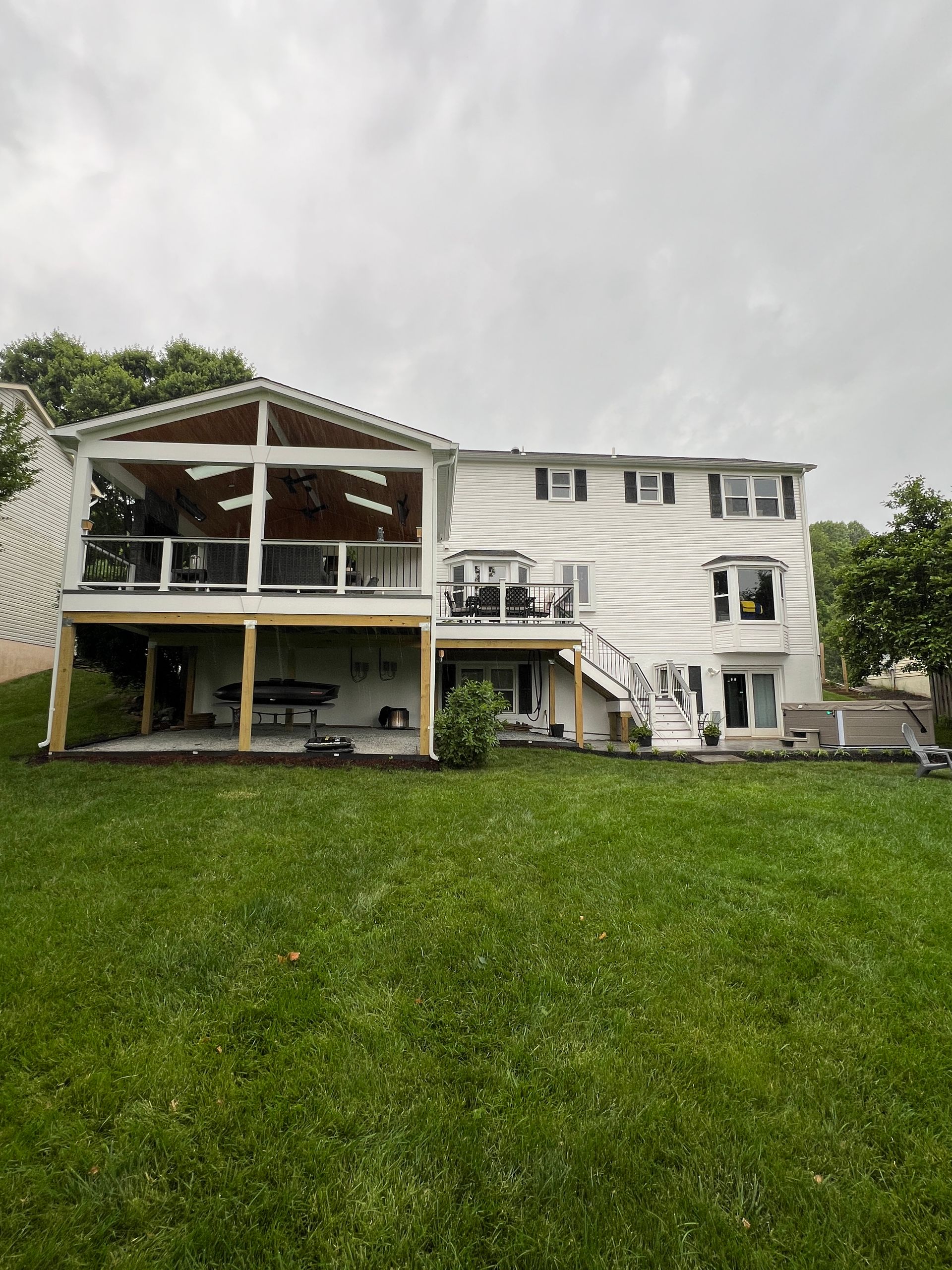 Trex Open Porch with Heaters and Stamped Concrete patio in Leesburg, VA