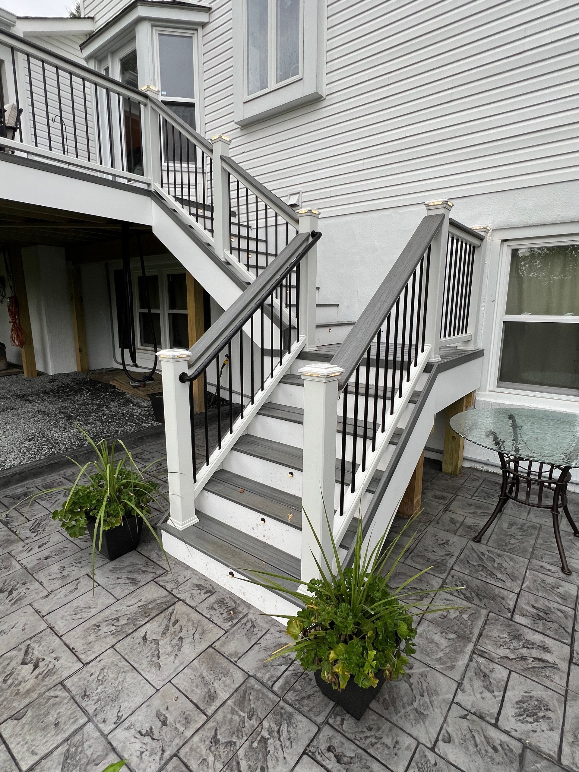 Trex Open Porch with Heaters and Stamped Concrete patio in Leesburg, VA