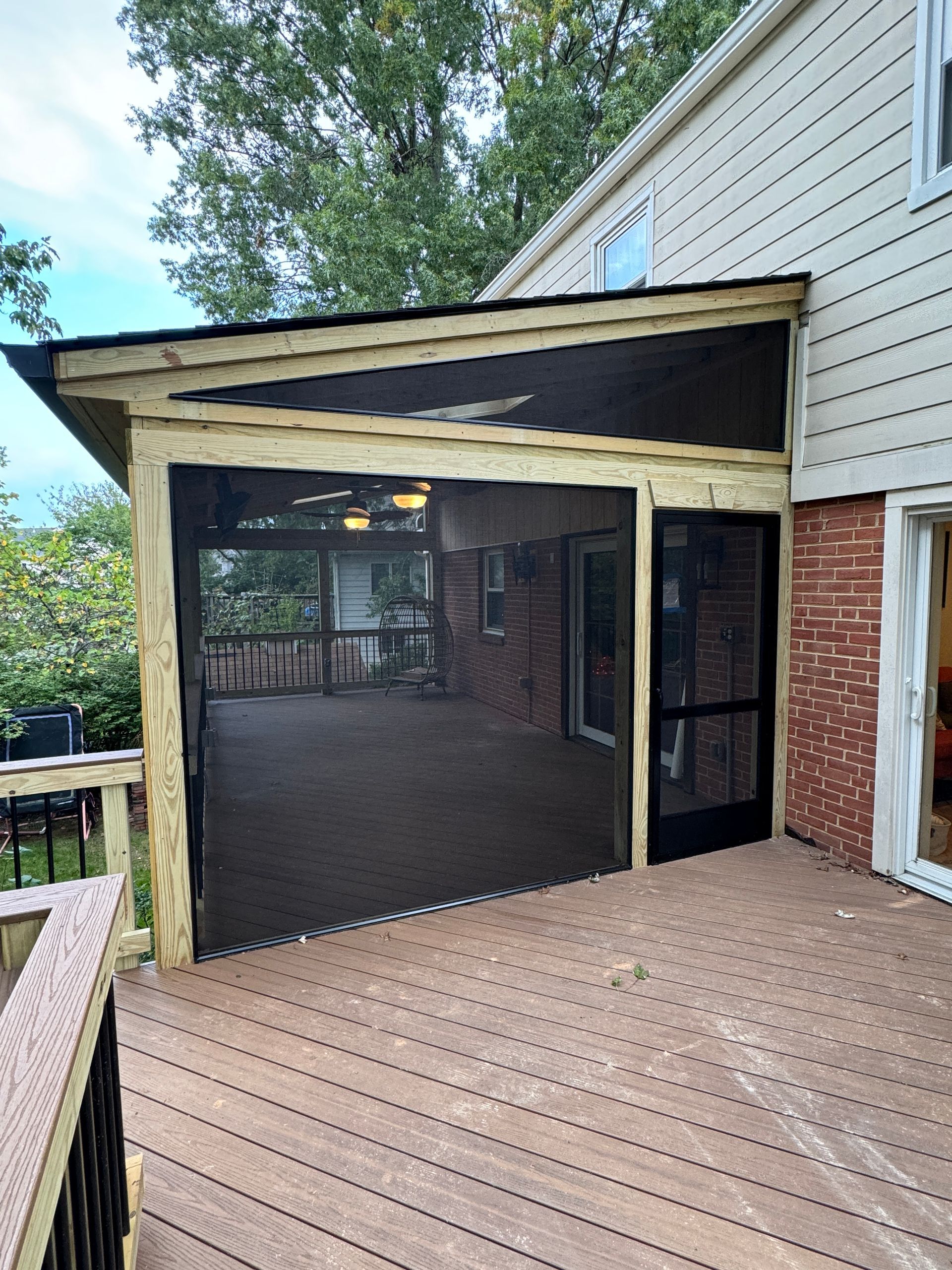Pressure Treated wood and Fiberon screened-in porch with Screeneze, and heaters in Mclean, VA