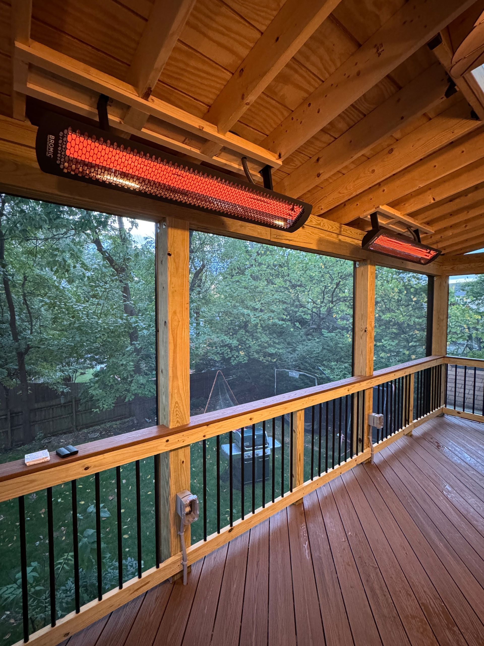 Pressure Treated wood and Fiberon screened-in porch with Screeneze, and heaters in Mclean, VA