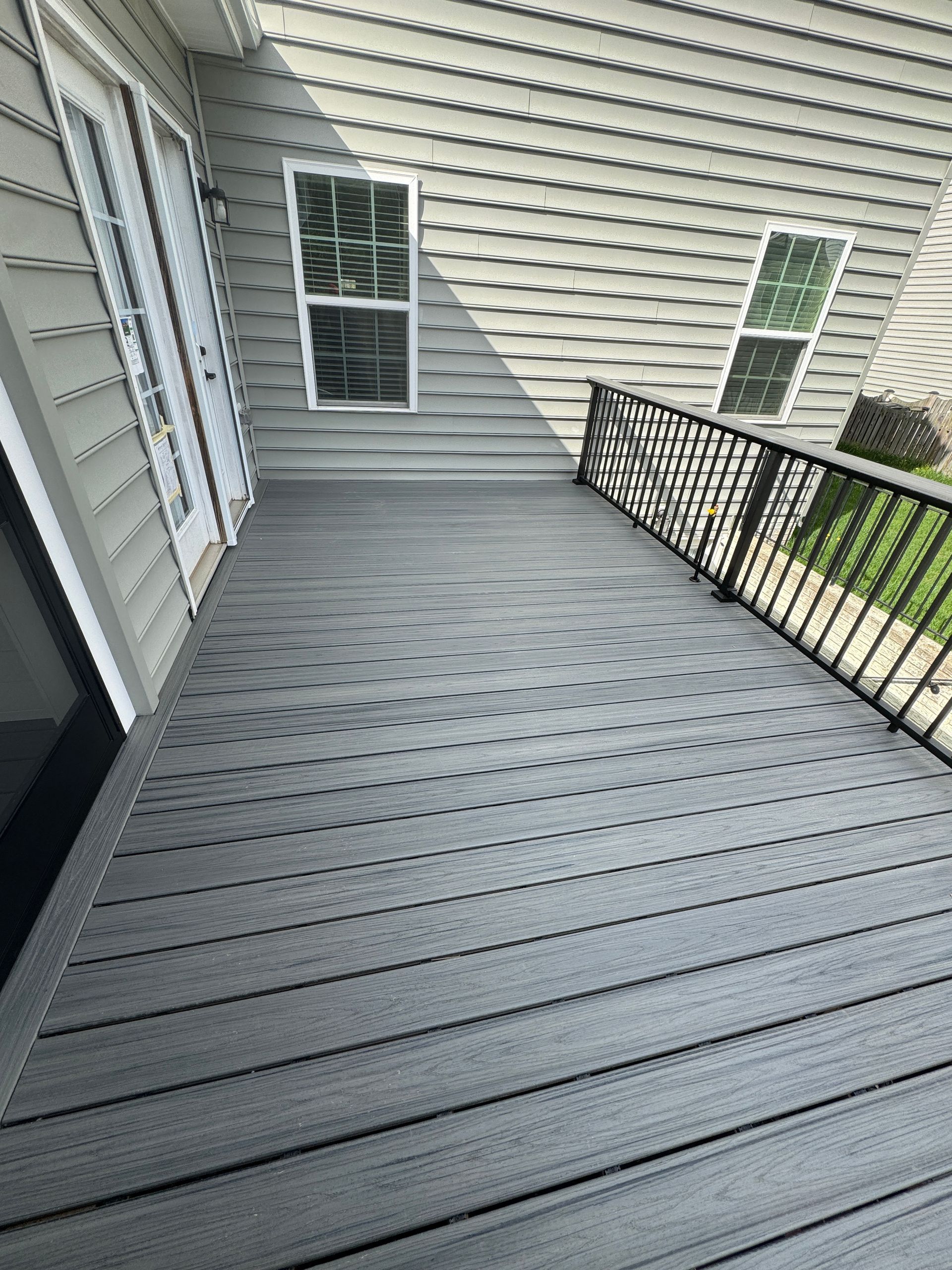 Trex screened in porch with Screen-Eze and Westbury Aluminum handrails, and Stamped Concrete in Aldie, VA