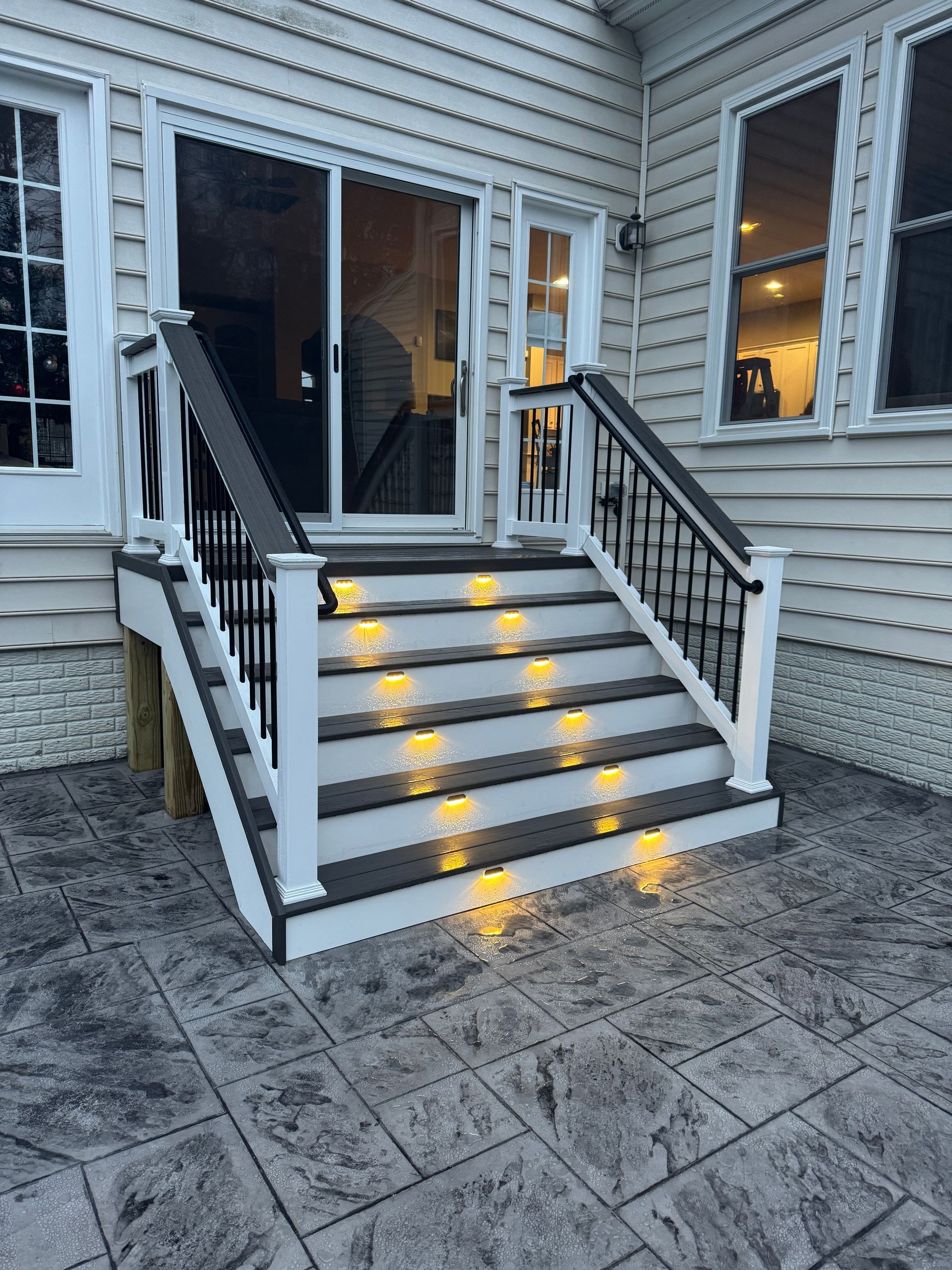 stamped concrete patio with fiberon deck steps in aldie, va