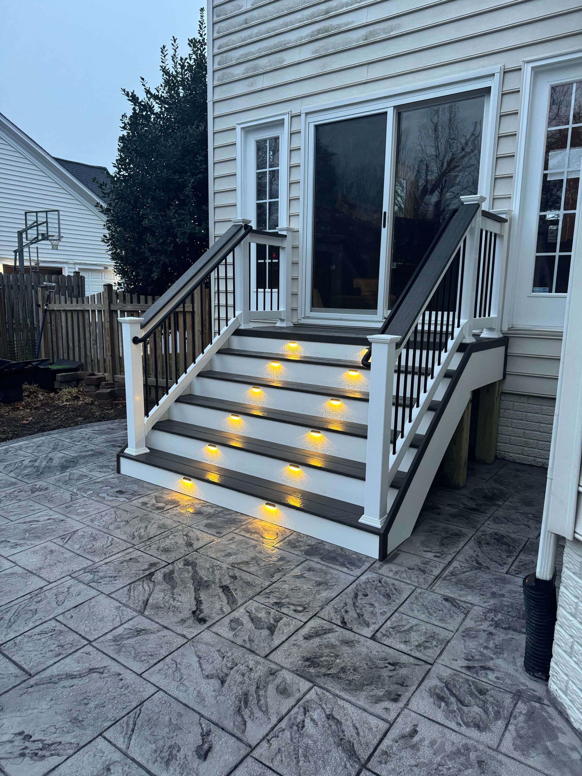 stamped concrete patio with fiberon deck steps in aldie, va