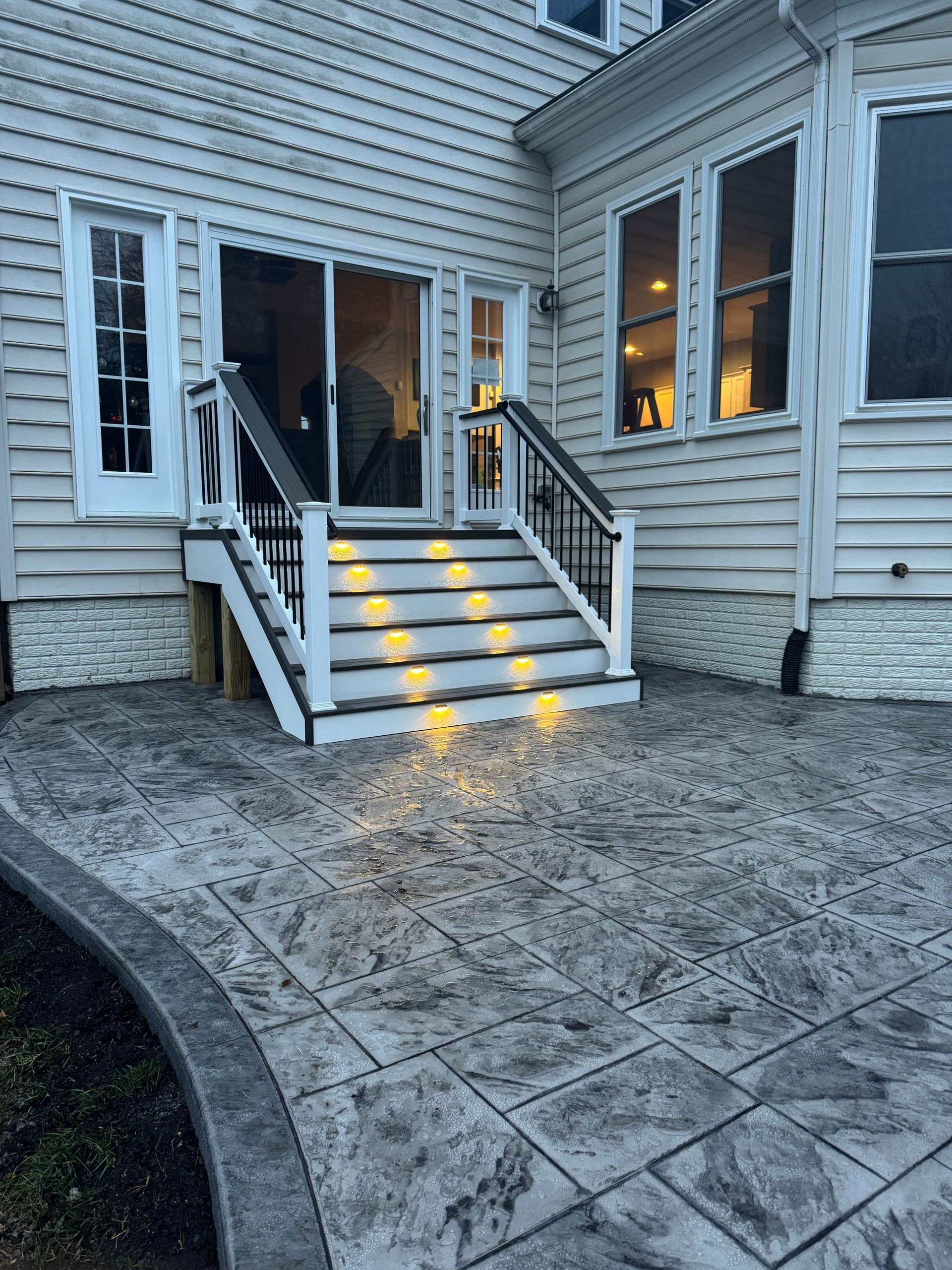 stamped concrete patio with fiberon deck steps in aldie, va