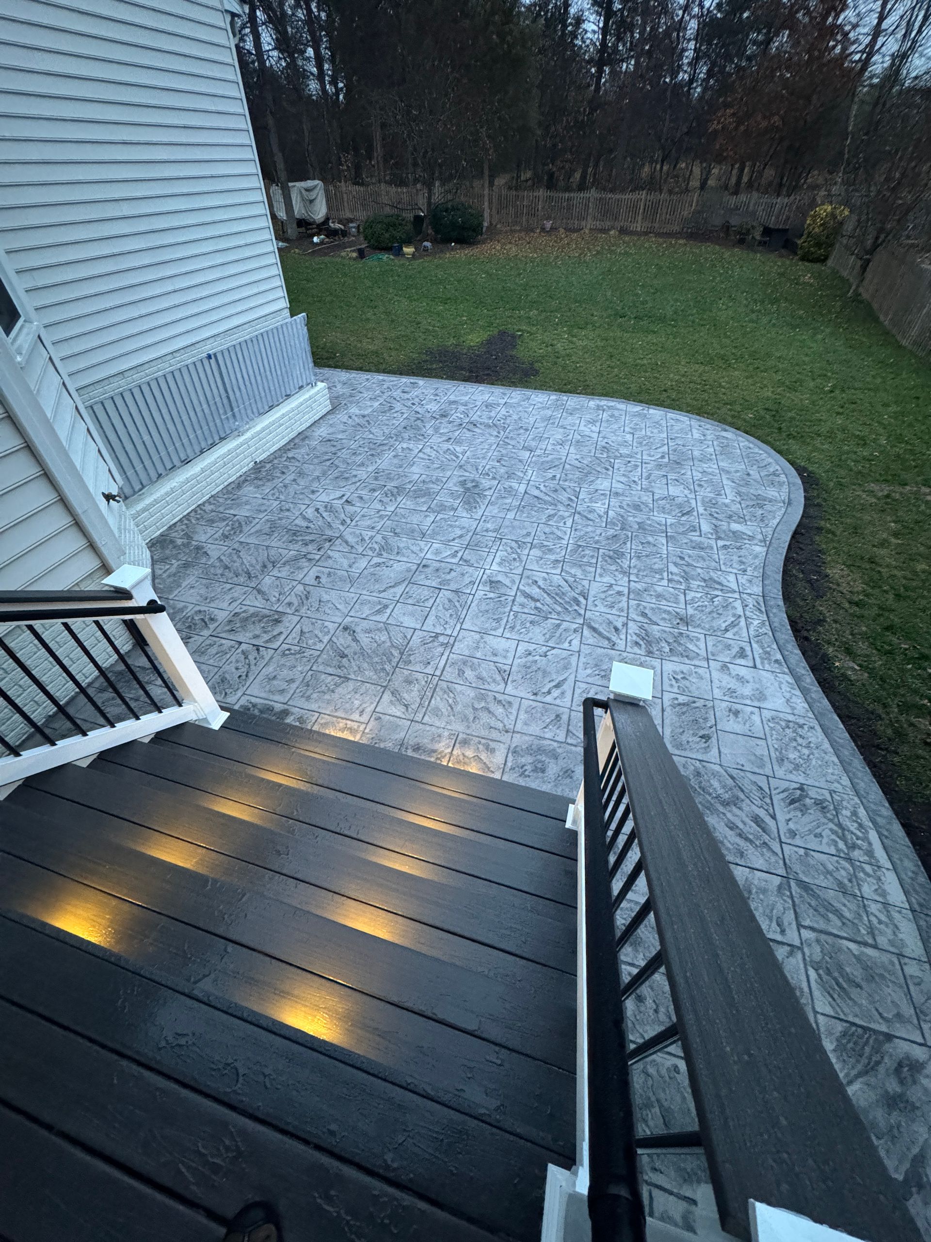 stamped concrete patio with fiberon deck steps in aldie, va