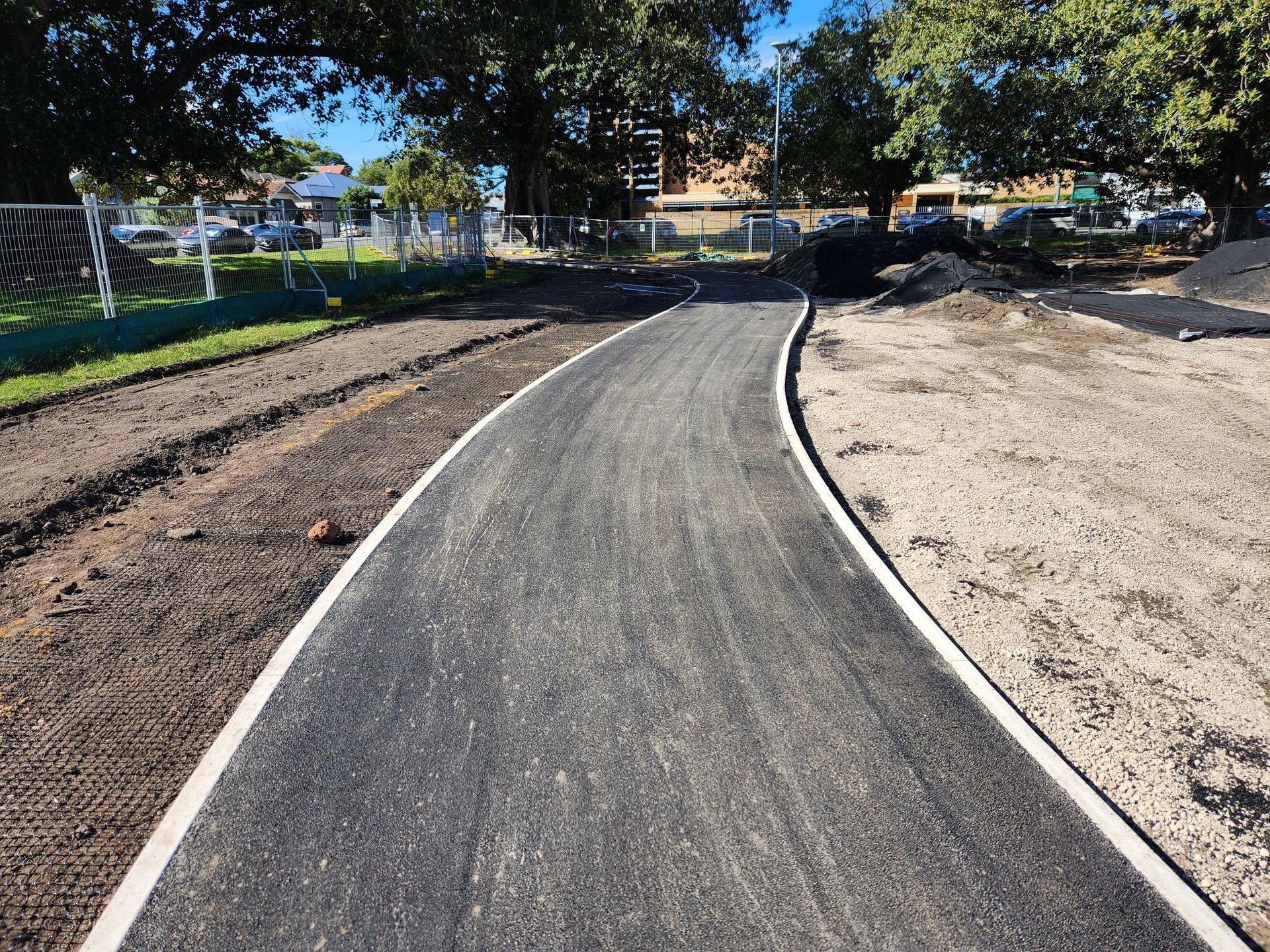 Paved Pathway With White Border In A Park — TAC Asphalt Services in Warners Bay, NSW