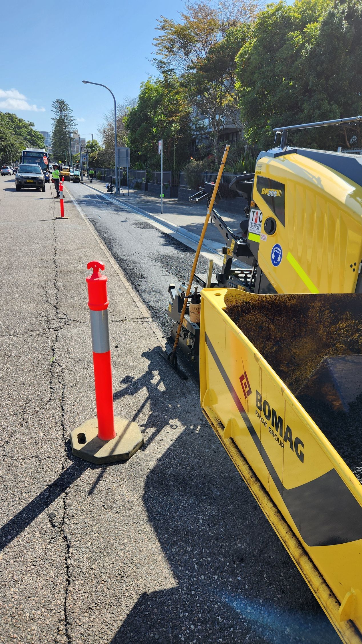 Road Paving In Progress, Featuring An Asphalt Paver — TAC Asphalt Services in Warners Bay, NSW